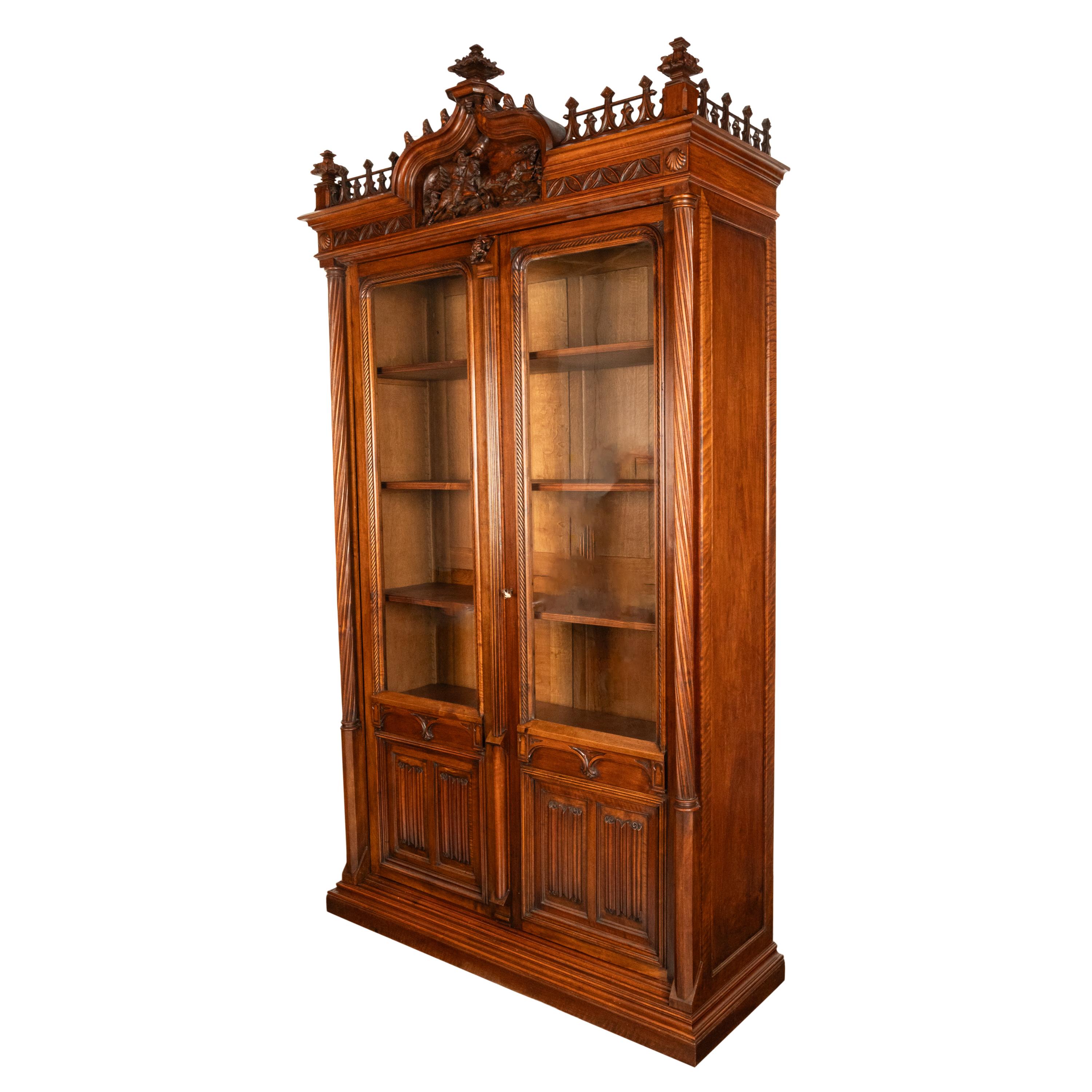 A very good carved French oak gothic library bookcase/bibliotheque, circa 1880.
This very handsome oak bookcase does break down into many parts for ease of movement and is easily disassembeled & assembled.
To the top are three large carved