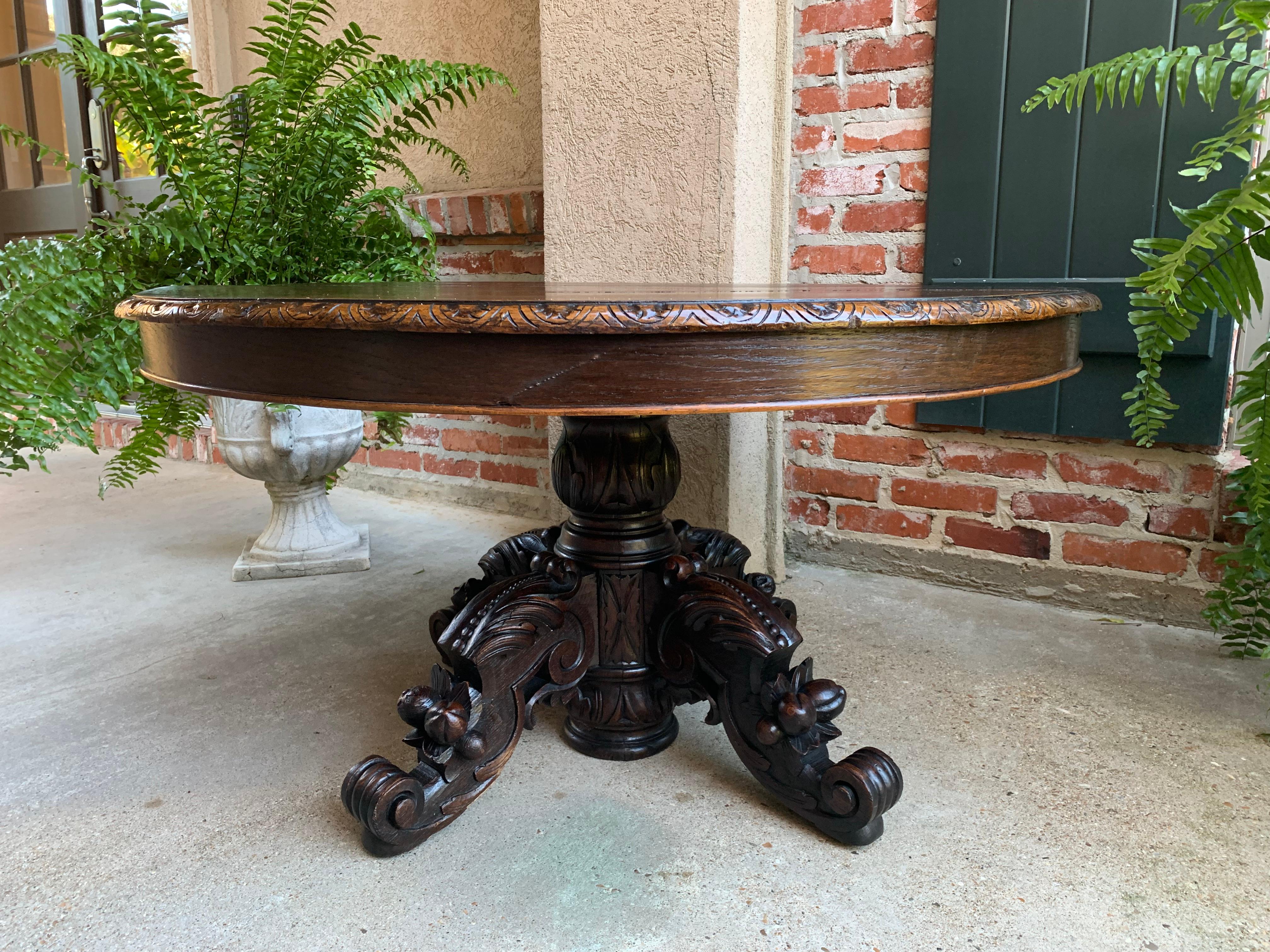 Antique French carved oak hunt coffee table renaissance black forest oval c1900

~Direct from France~
~Absolutely stunning antique French carved Black Forest oval coffee table!~
~Massive carved pedestal base supported by ornate hand carved