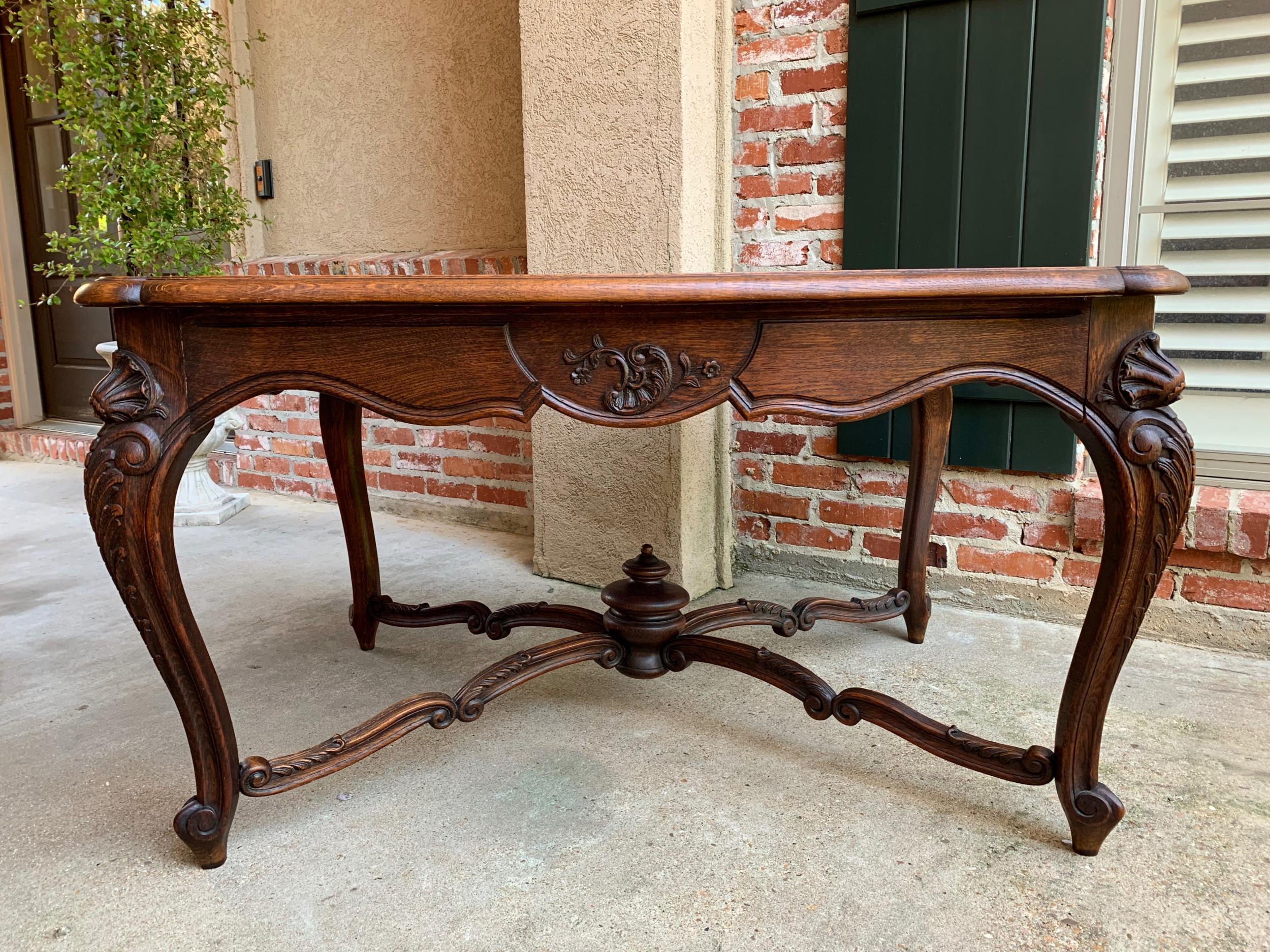 Antique French carved oak parquet dining table kitchen library Louis XV style

~Direct from France~
~Lovely antique French carved oak dining table with a gorgeous profile!~
~~Full parquet beveled edge serpentine oak top~
~Carved serpentine