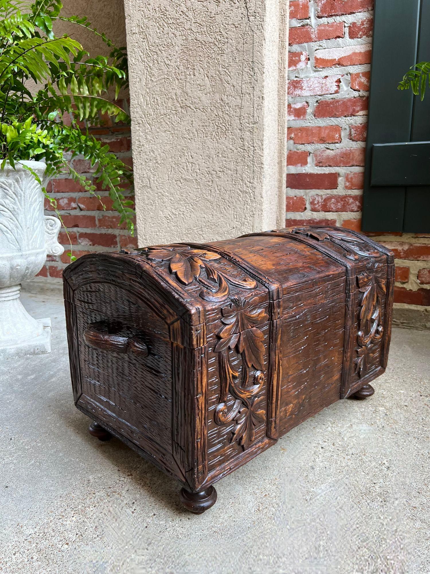Antique French Carved Oak Petite Trunk Chest Black Forest Faux Bois Planter Box.

Direct from France, a highly carved petite size antique chest/trunk, in Black Forest style with large carved foliage/leaf banding across the dome top and both