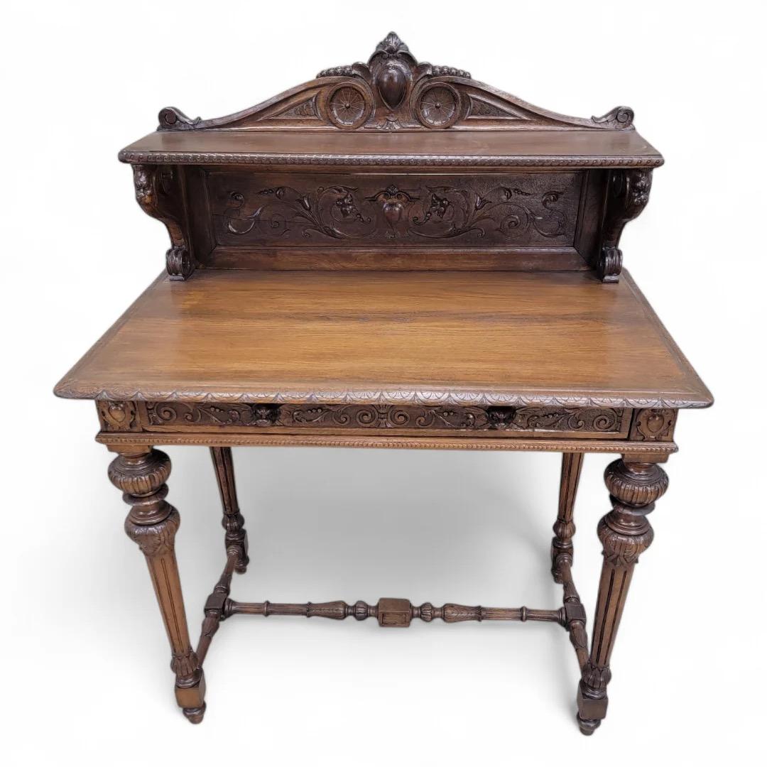 Antique French Carved and Finely Detailed Oak Petite Writing Desk

This exquisite 19th Century French carved oak petite writing desk exemplifies the artistry and craftsmanship of its era. Featuring intricate detailing, the desk is both functional