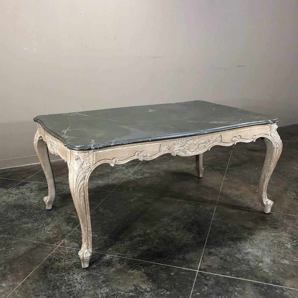 Antique French hand-carved oak Regence painted faux marble-top dining table - desk features boldly carved cabriole legs, a contoured apron adorned with foliate motifs, all with a white washed oak finish that contrasts nicely with the darker
