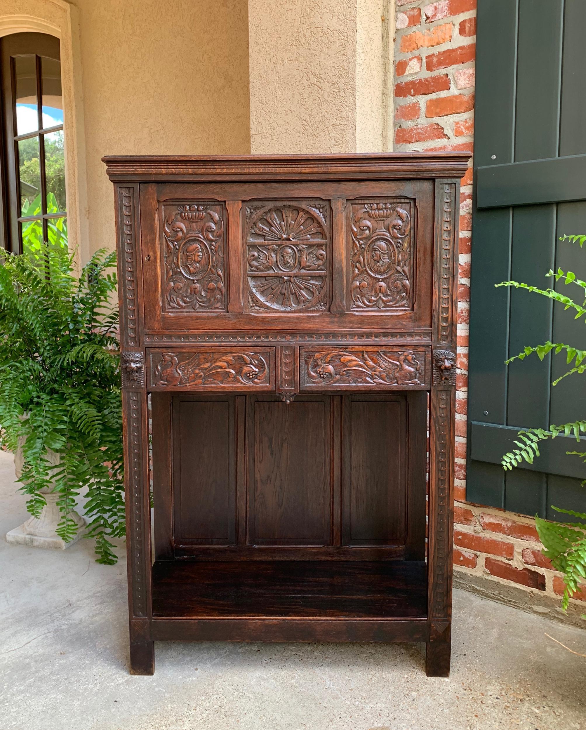 Antique French carved oak renaissance cabinet bookcase court cupboard 19th c.

~Direct from France~
~Unique hand carved designs on this lovely antique French cabinet, in a versatile size and style.~
~Full length upper door has distinctive carvings