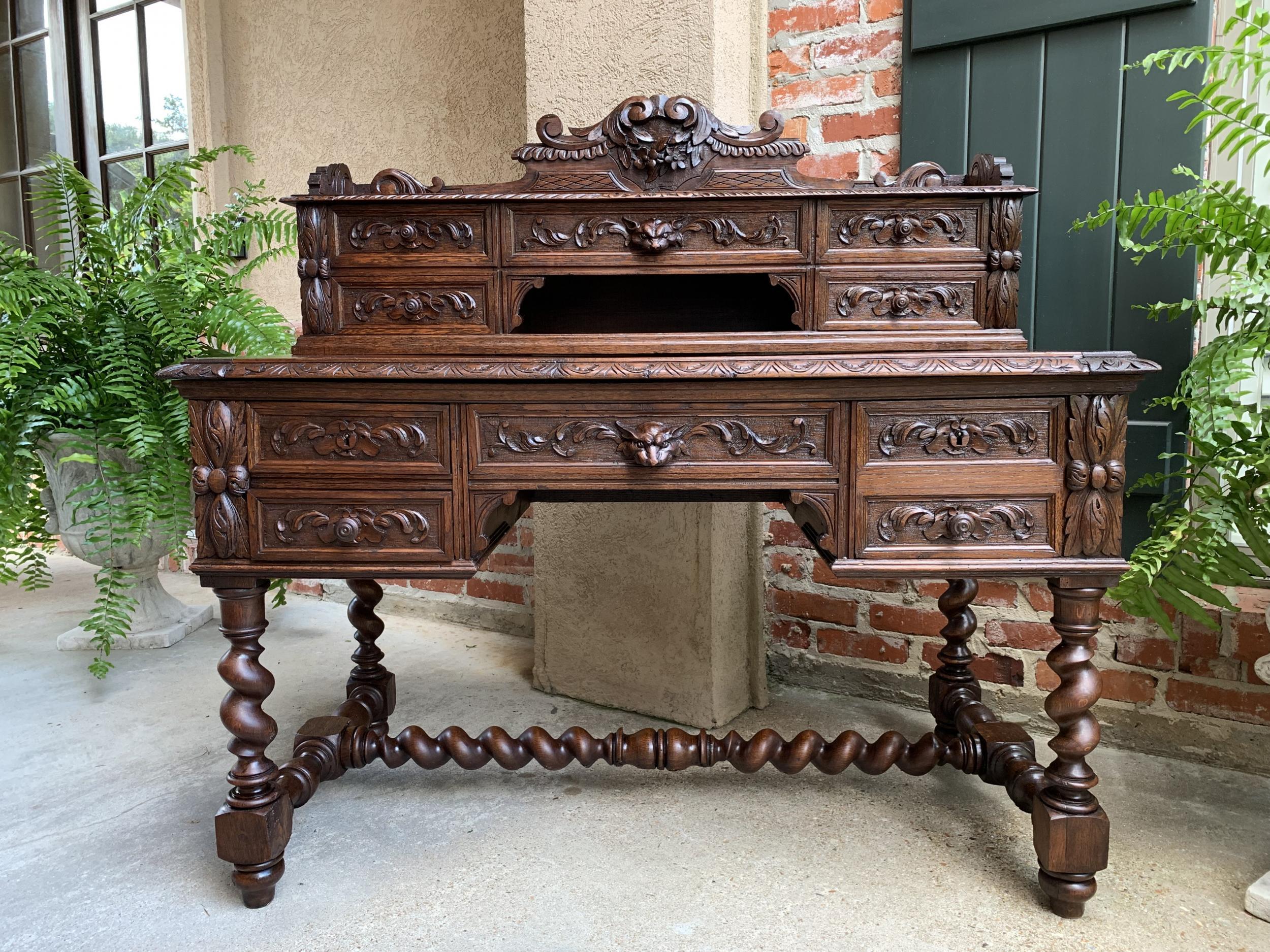Antique French carved oak Renaissance desk barley twist Gothic library 19th c

~Direct from France~
A superb antique French oak desk with exquisite, ornate carvings!
~The upper desk has a beautiful carved crown with center ribbon/wreath and