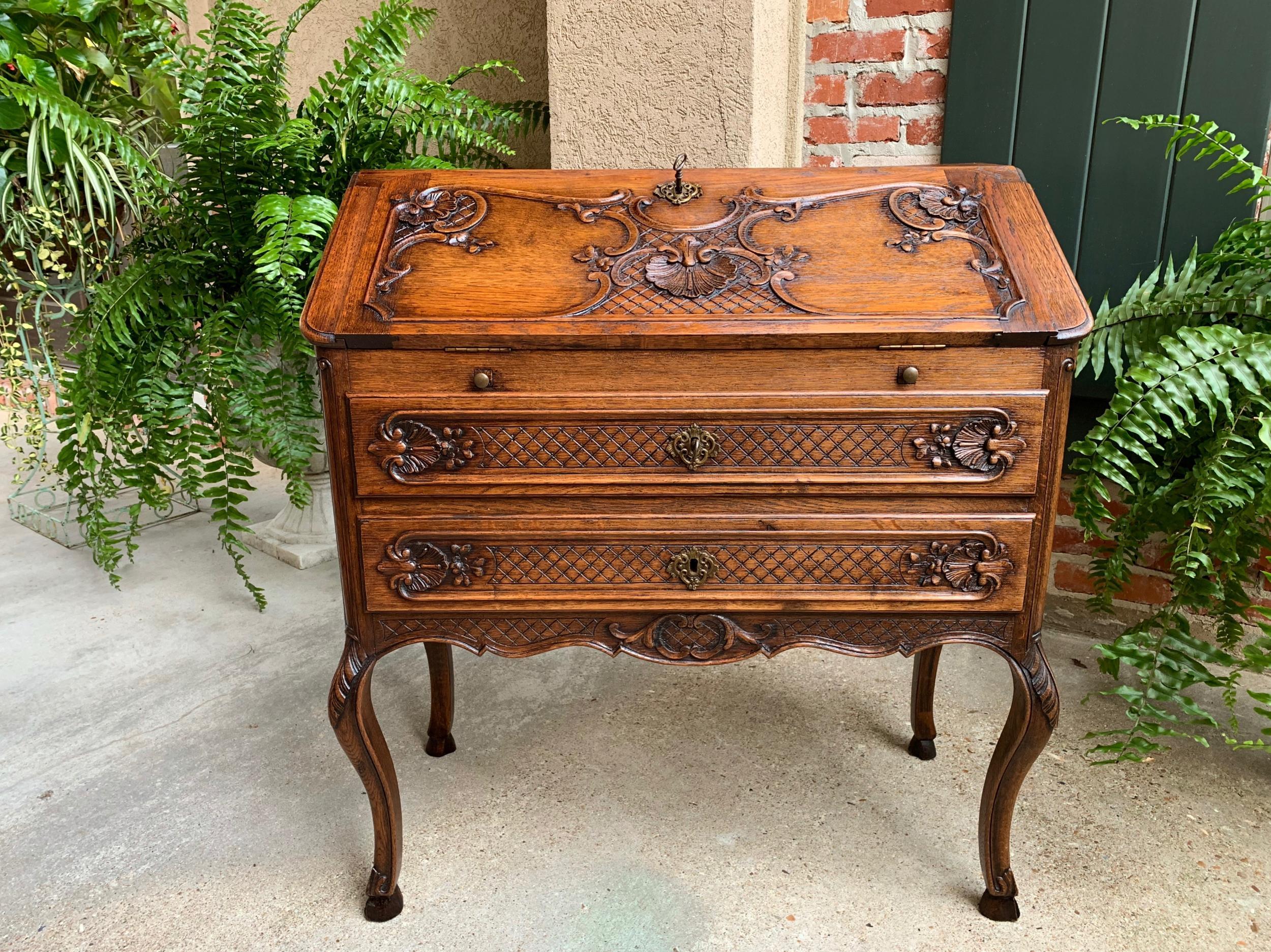 Antique French carved oak secretary desk bureau drop front Louis XV style

~Direct from France~
~A lovely antique French carved “drop front” secretary/desk with quintessential French style from top to bottom!~
~Carved oak French “drop front” or