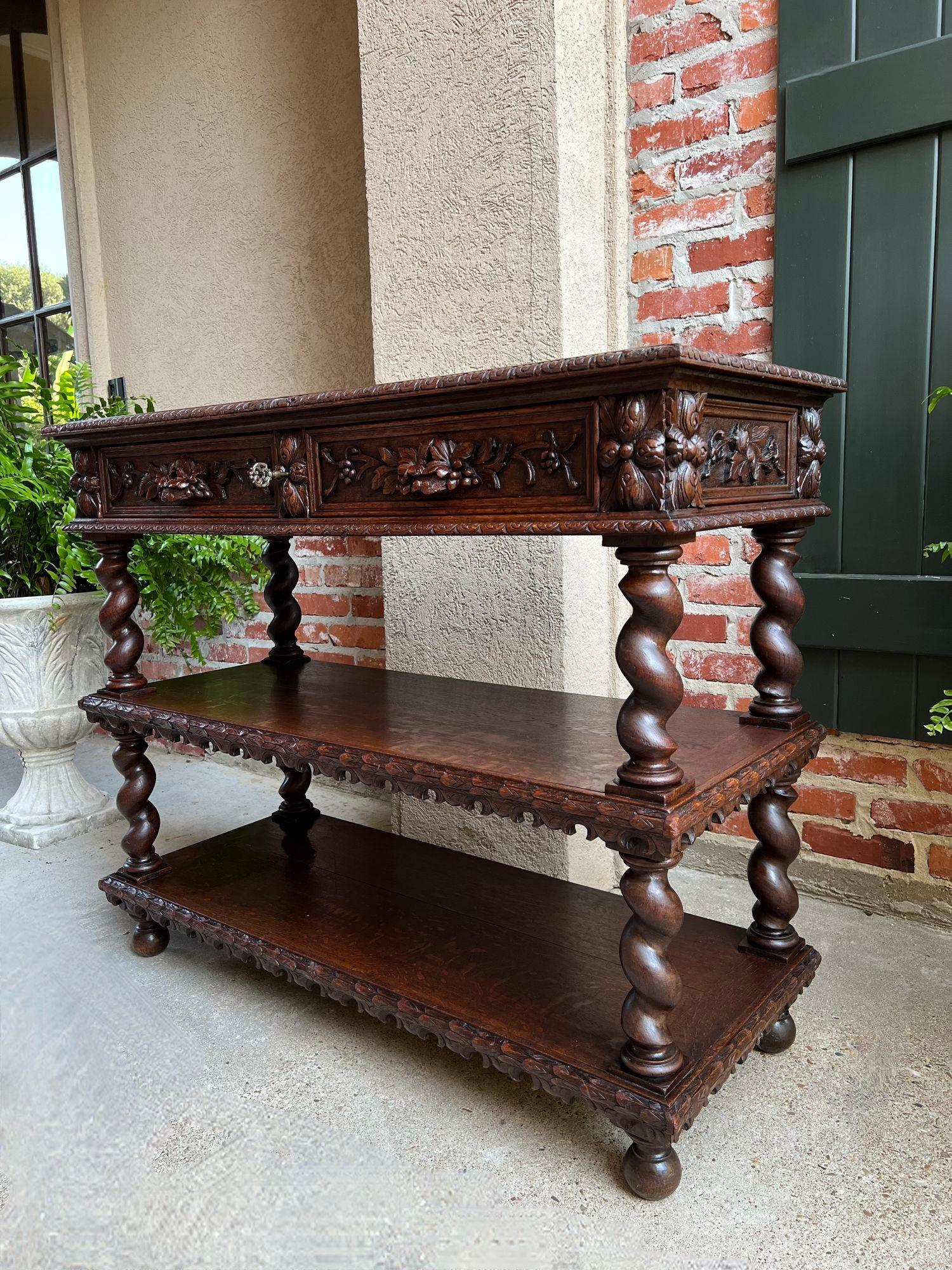 Antique French Carved Oak Server Sideboard Barley Twist Renaissance Bookshelf.

Direct from France, a stunning 19th century French dessert server/sideboard with exquisite hand carving details.
Carved beveled edge top above the two drawers, each