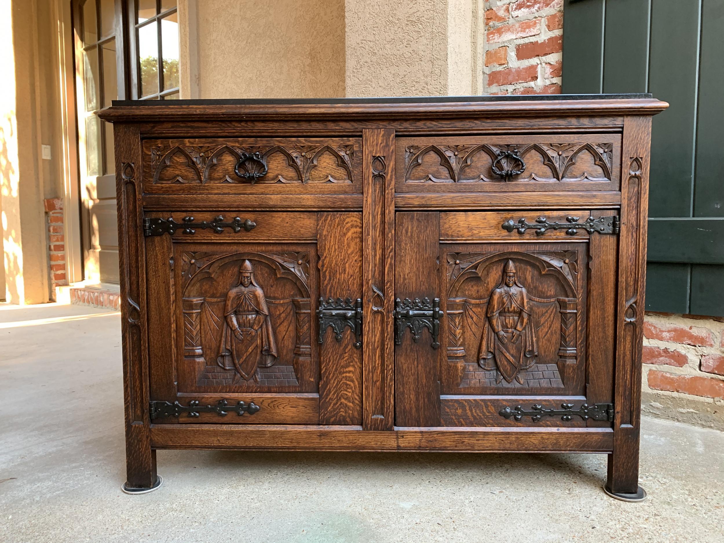 Antique French carved oak sideboard cabinet black marble renaissance gothic

~Direct from France~
~Lovely and versatile antique French carved sideboard/cabinet~
~Double drawers feature carved gothic tracery and heavy black metal drawer
