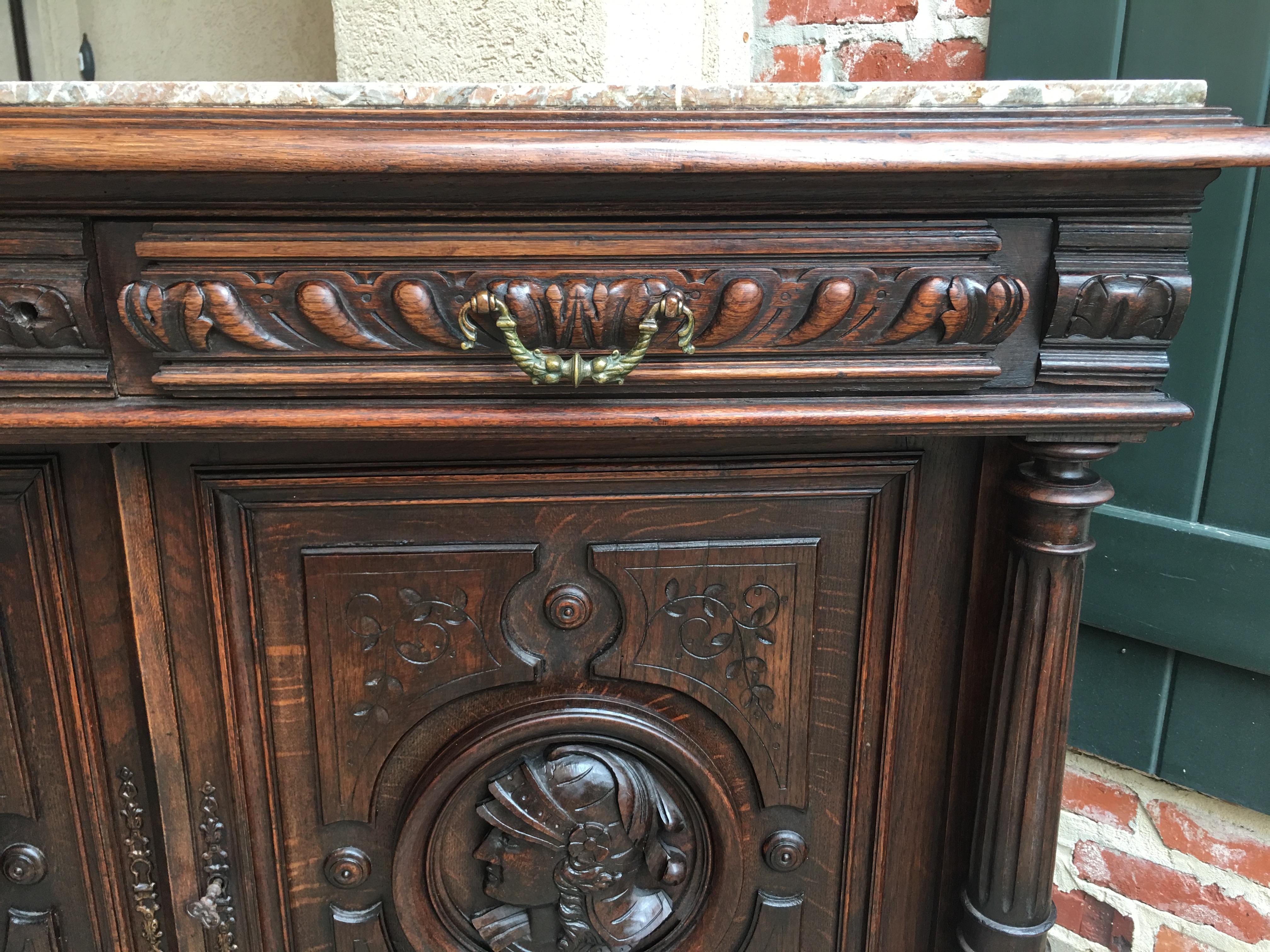 Direct from France, a GREAT size antique French server, with detailed carvings and a marble top, this piece could be placed in SO many different areas from foyer to dining to family room or bedroom!~
~Double “drawers over doors”, the perfect