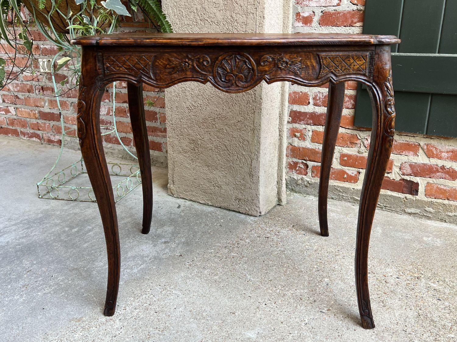Antique French carved oak sofa side lamp table Serpentine Louis XV nightstand.

Direct from France, another lovely carved French side or sofa table with classic French Louis XV style and elegance.
Beveled serpentine edge oak tabletop above the