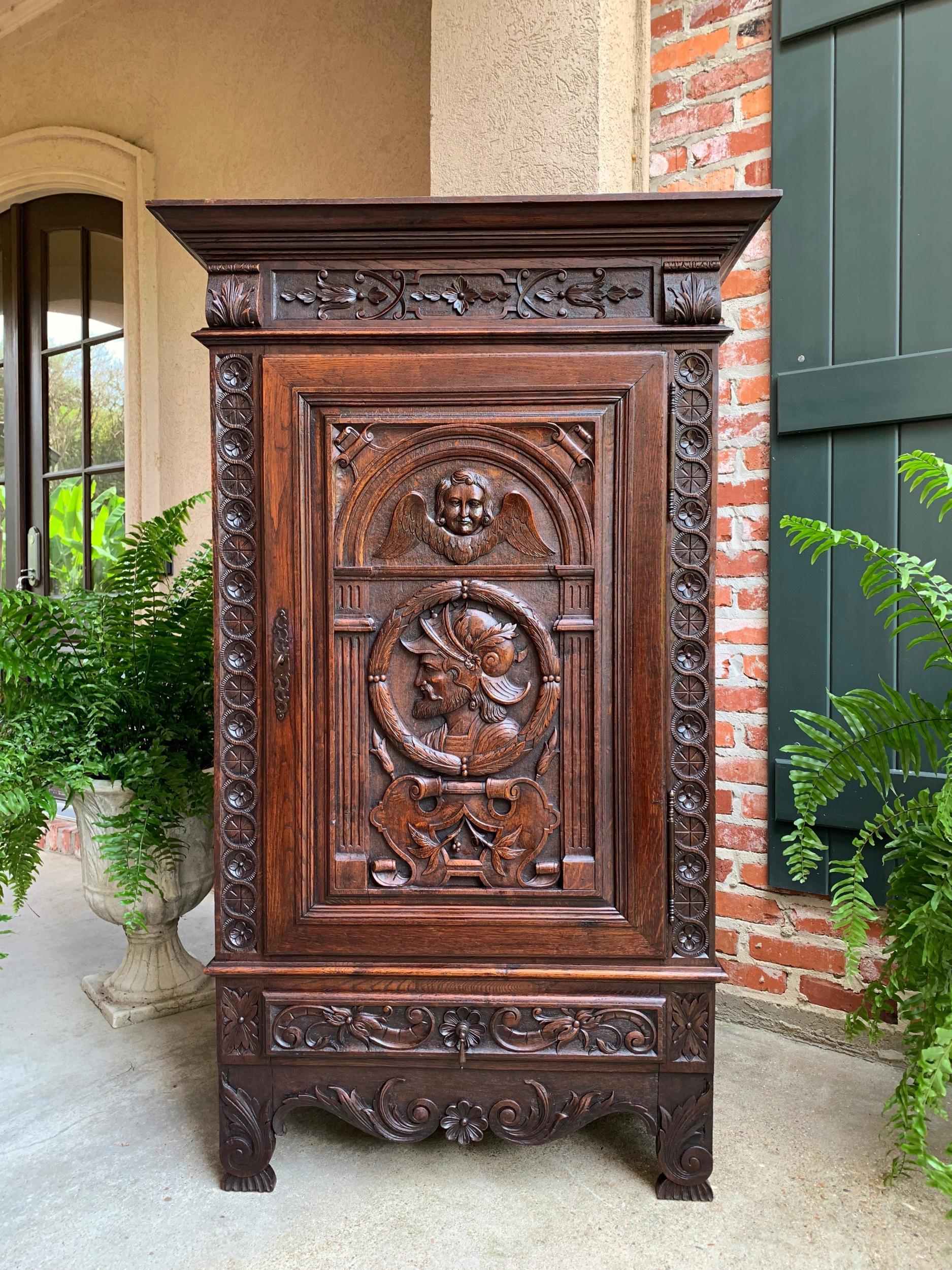 Antique French carved oak storage cabinet Renaissance Roman Centurion 19th cent

~Direct from the Brittany region of France, an ornately hand carved antique French oak cabinet~
~These cabinets are one of our most requested antiques, as they have so