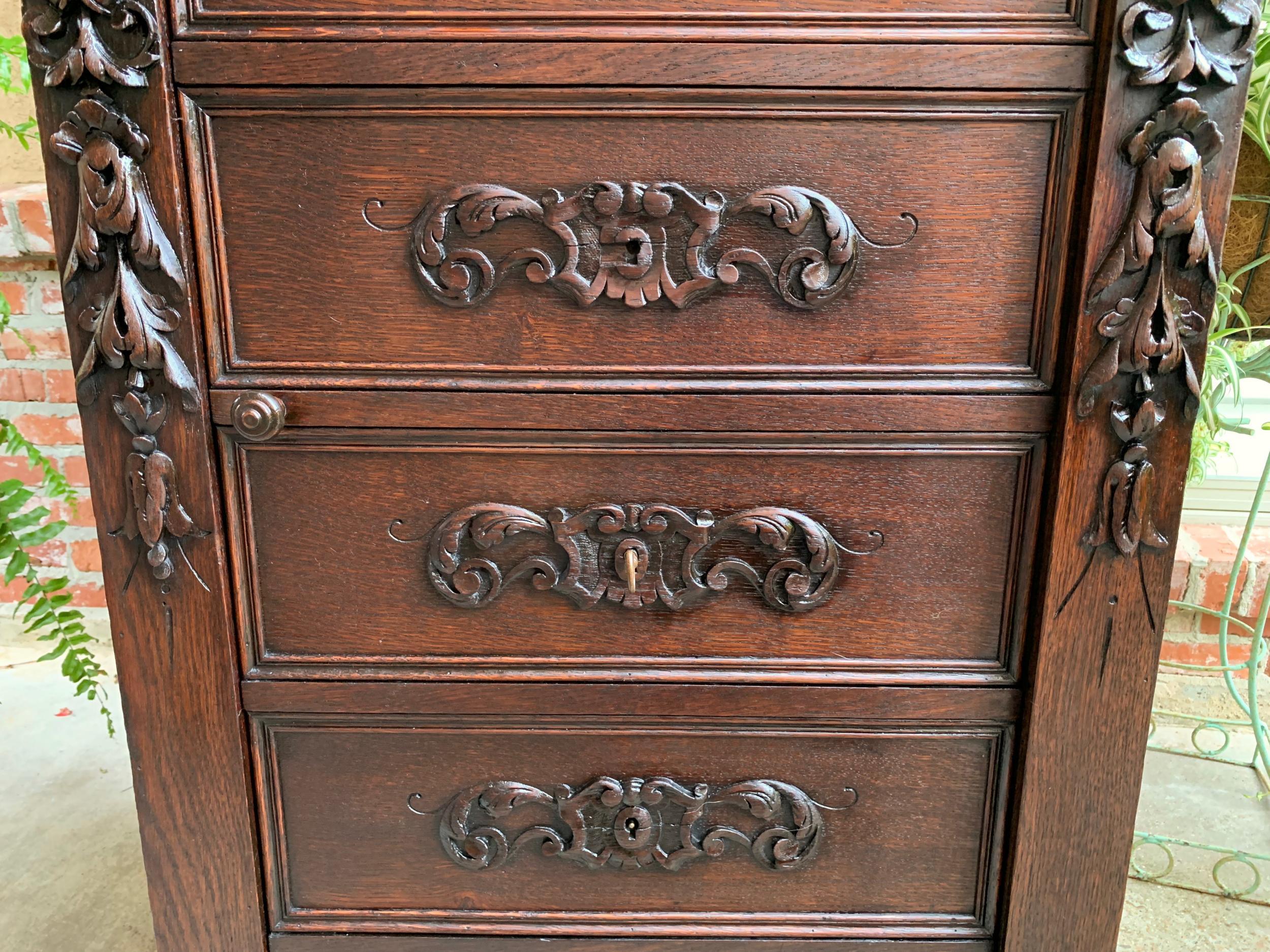19th century French  Tall Cabinet Faux Chest of Drawers Louis XIV Carved Oak For Sale 9