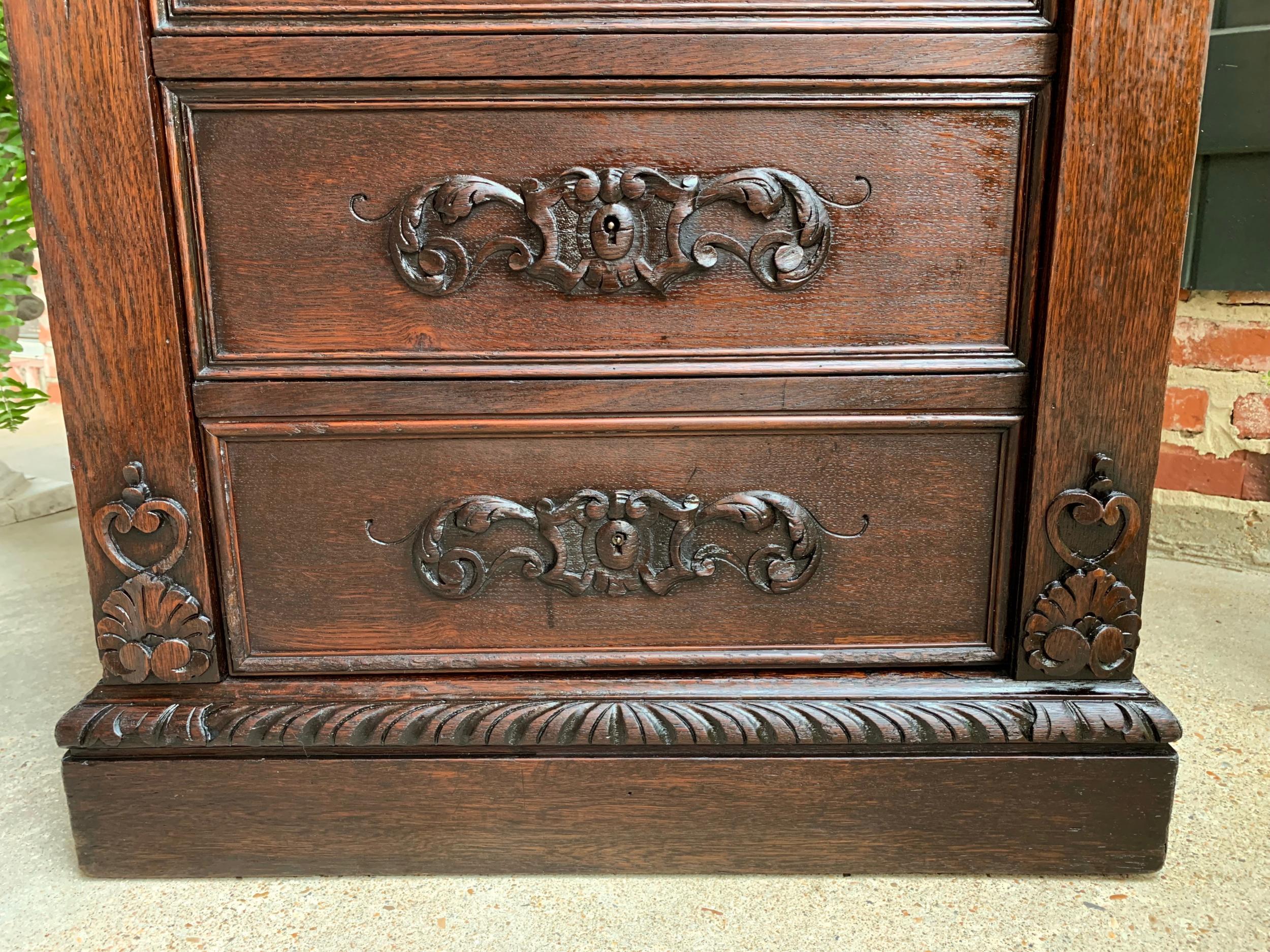 19th century French  Tall Cabinet Faux Chest of Drawers Louis XIV Carved Oak For Sale 10