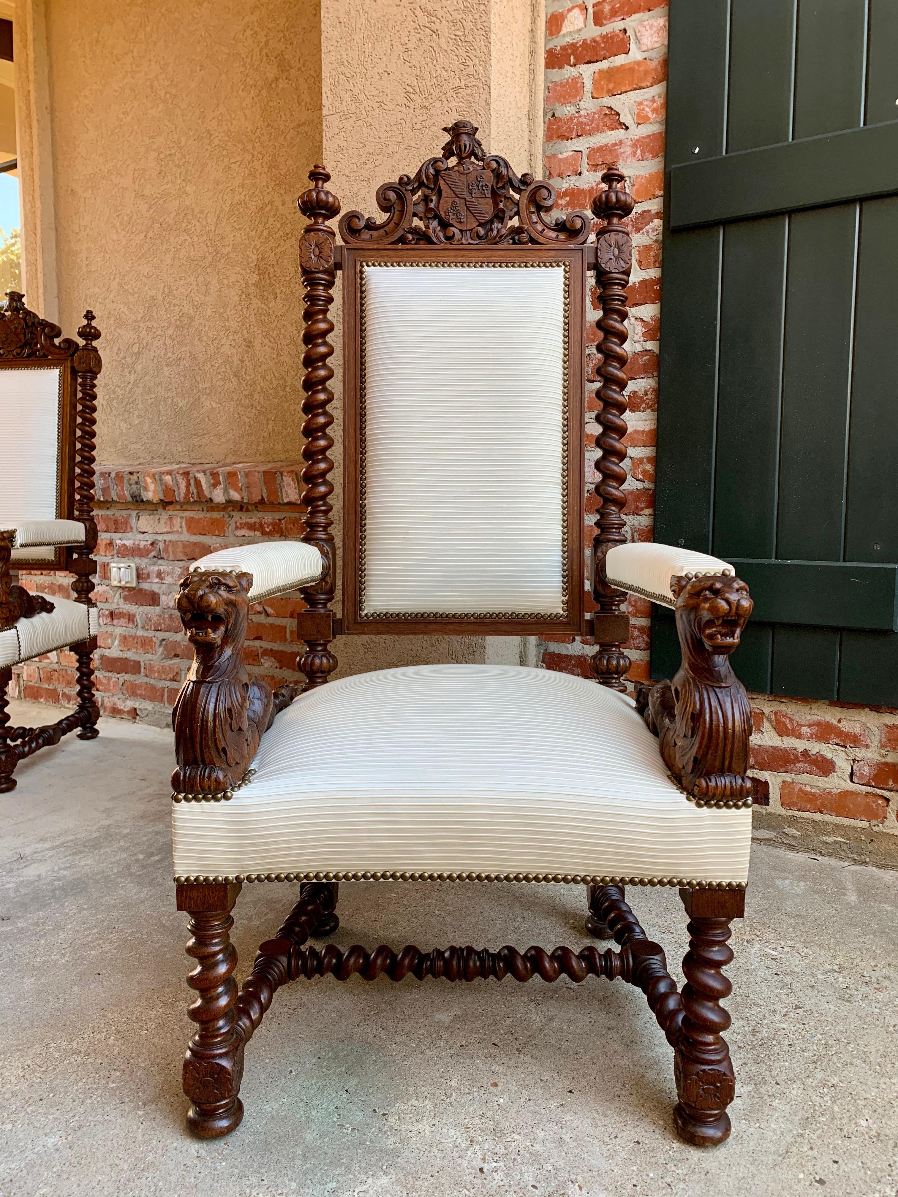 Direct from France, a large antique French carved oak fireside/arm chair or fauteuil, with stunning features!~
~High carved upper crown features a center carved coat of arms flanked by French scrolls~
~Full length barley twist posts support the