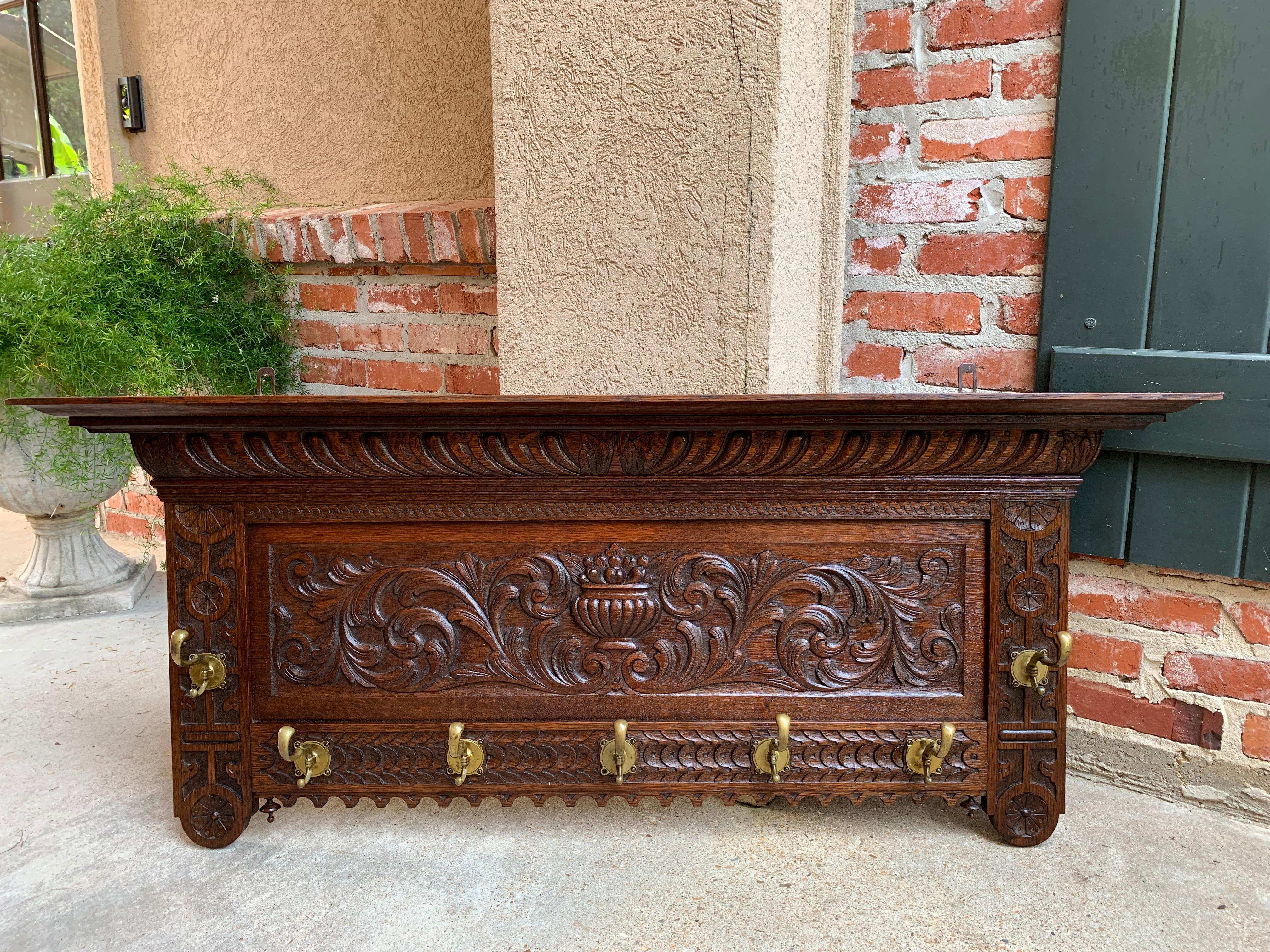 Direct from France, a large (over 4 ft. length) and gorgeous carved antique French wall shelf.
~ Outstanding carvings throughout, with carved French gadrooning on the upper crown above the oversized large center panel, with geometric carvings down