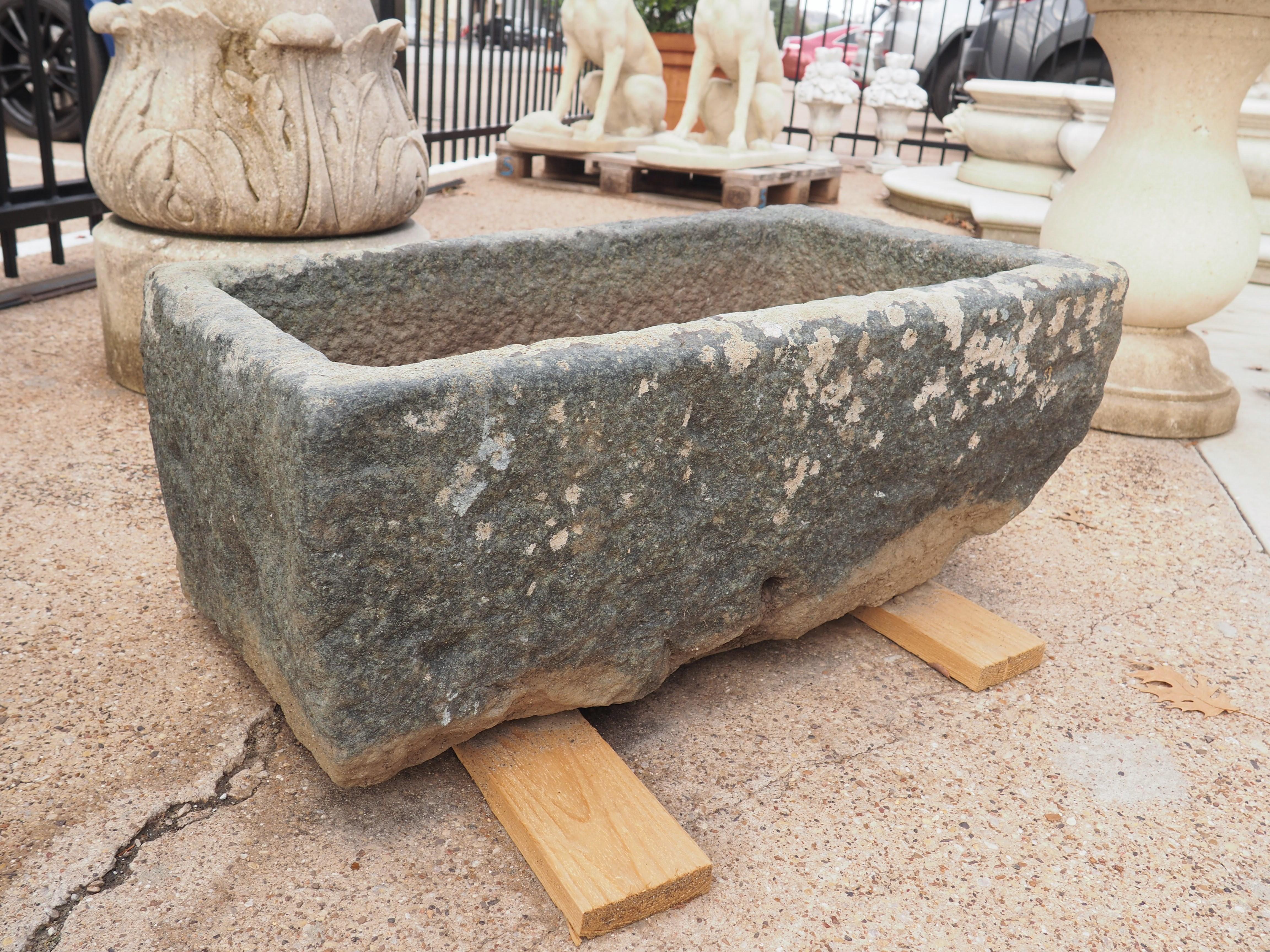 Stone troughs, such as this carved rectangular one from France, have been used in rural Europe for centuries, making it quite difficult to determine the carving date. Cast iron models began to replace the hand-carved stone versions in the mid-19th