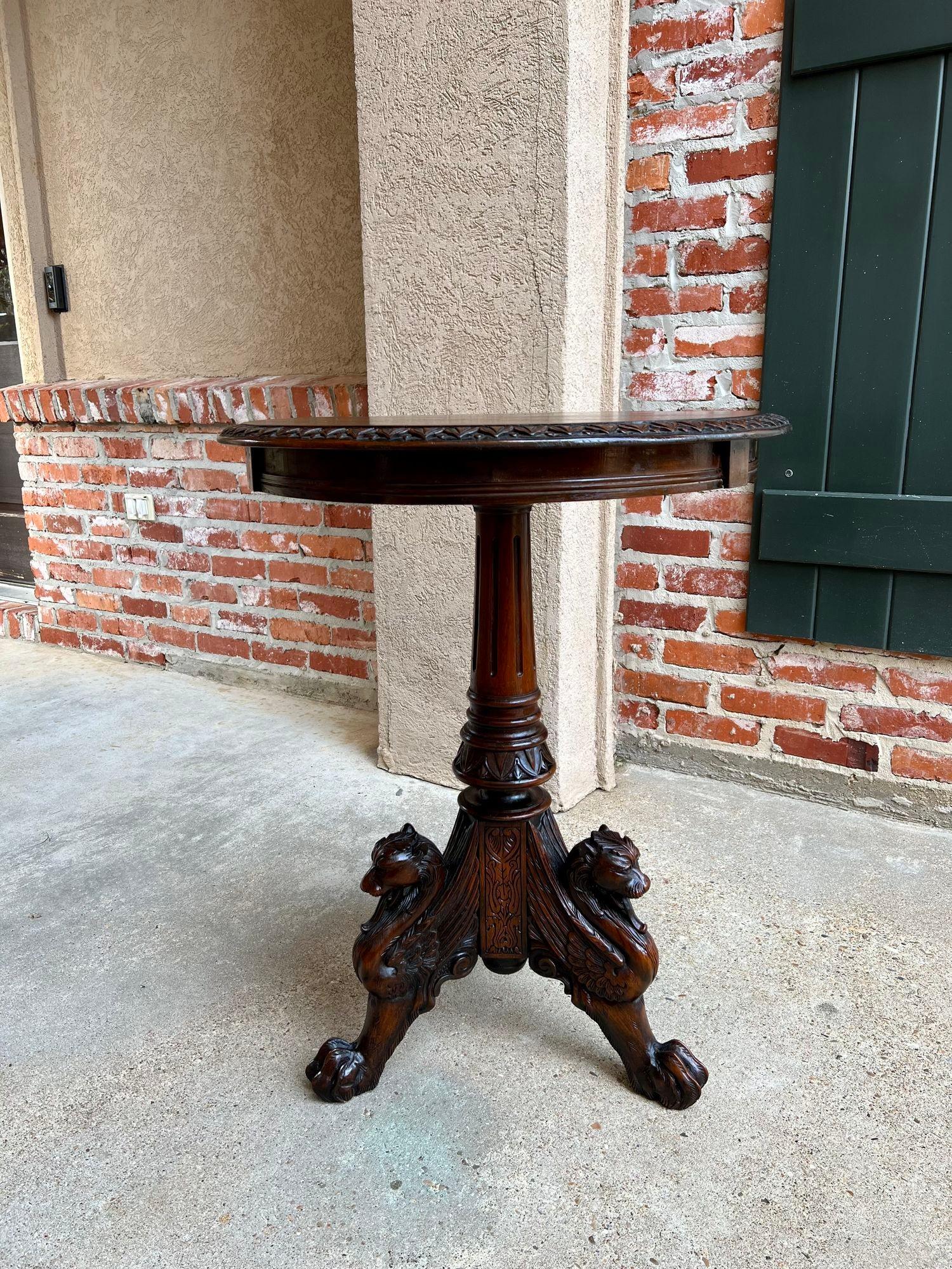 Antique French Carved Round End Table Neoclassical Walnut Tripod Gueridon.

Direct from France, a highly carved round end or sofa table with a beautiful profile and versatile smaller size.  Carved beveled edge on the round top with a reeded apron