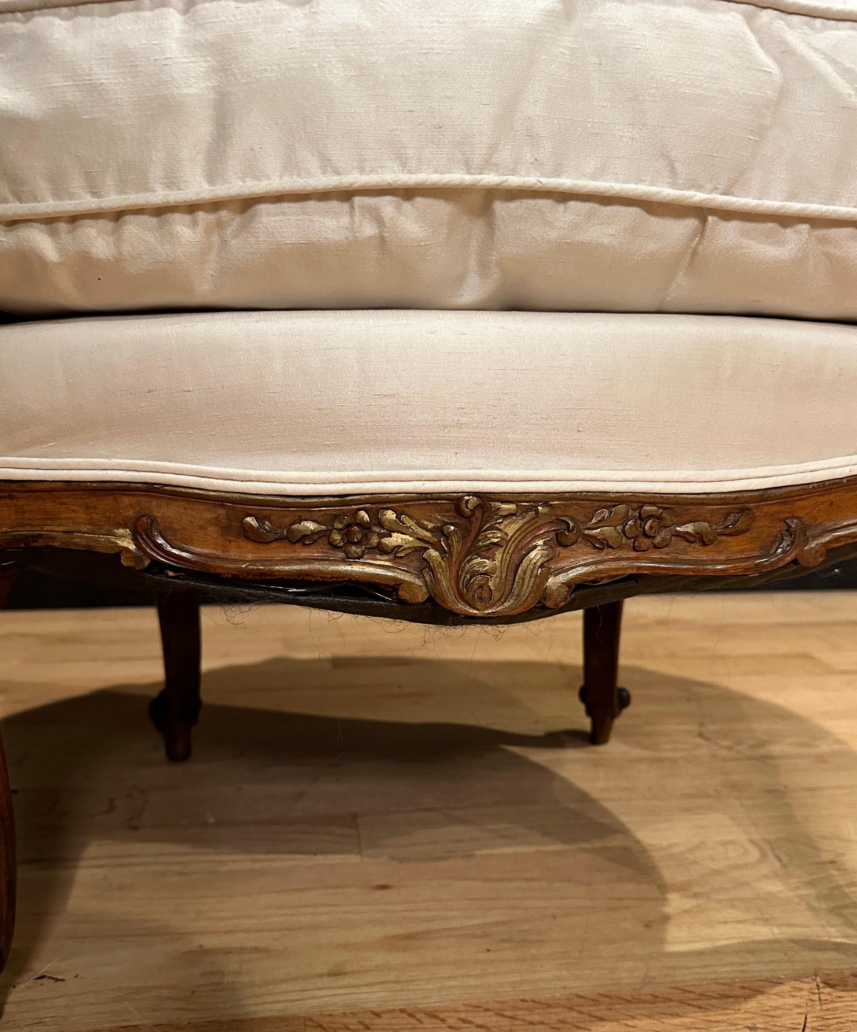 Antique French Carved Walnut And Parcel Gilt Armchair In Good Condition For Sale In Norwood, NJ