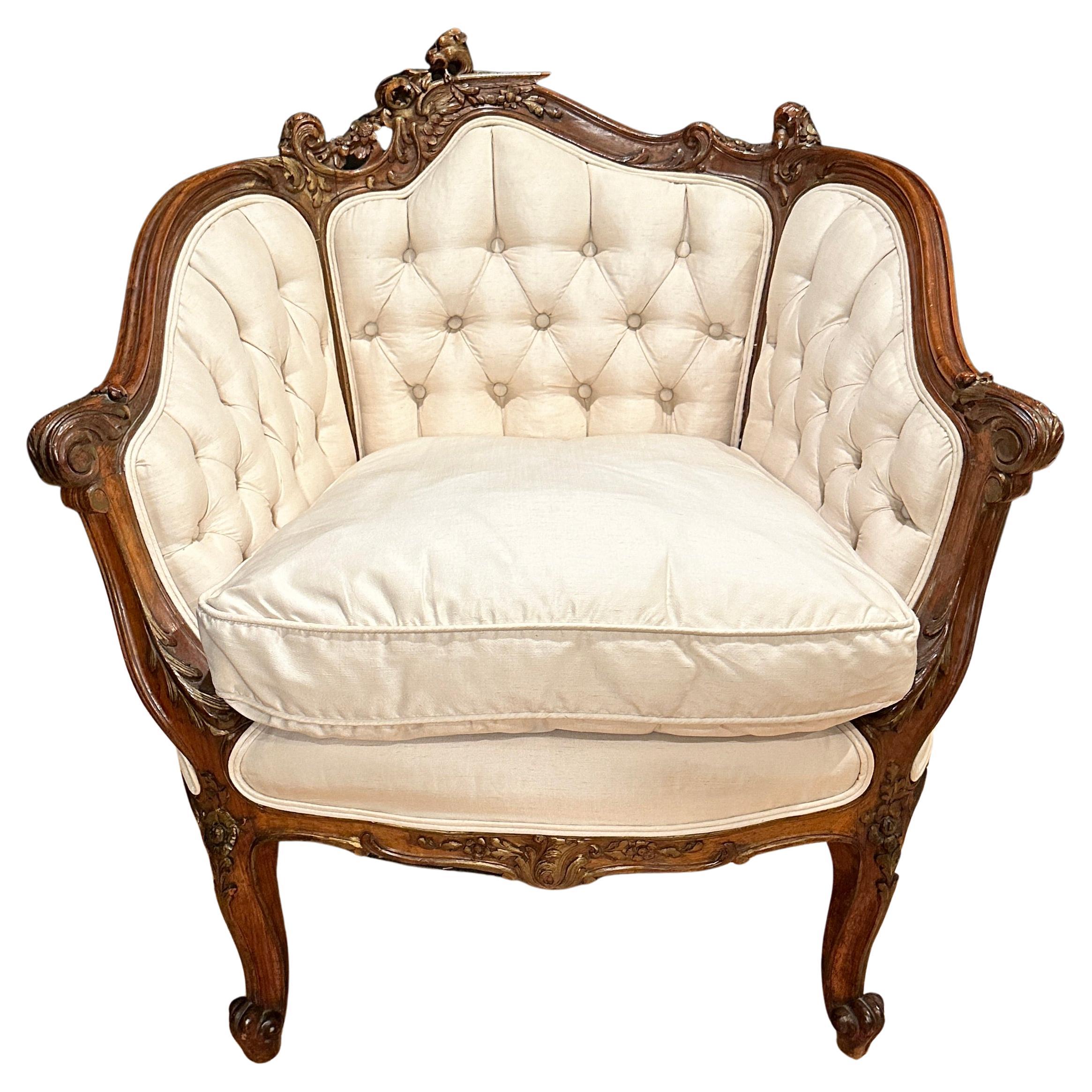 Antique French Carved Walnut And Parcel Gilt Armchair For Sale