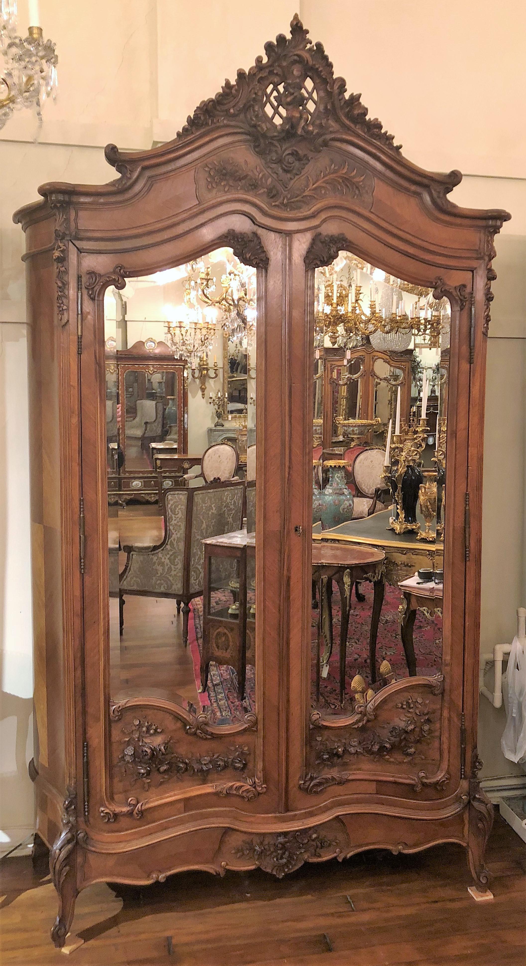 Antique French carved walnut armoire.