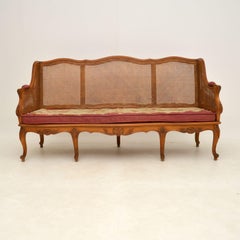 Antique French Sofa Bergere in noce intagliato