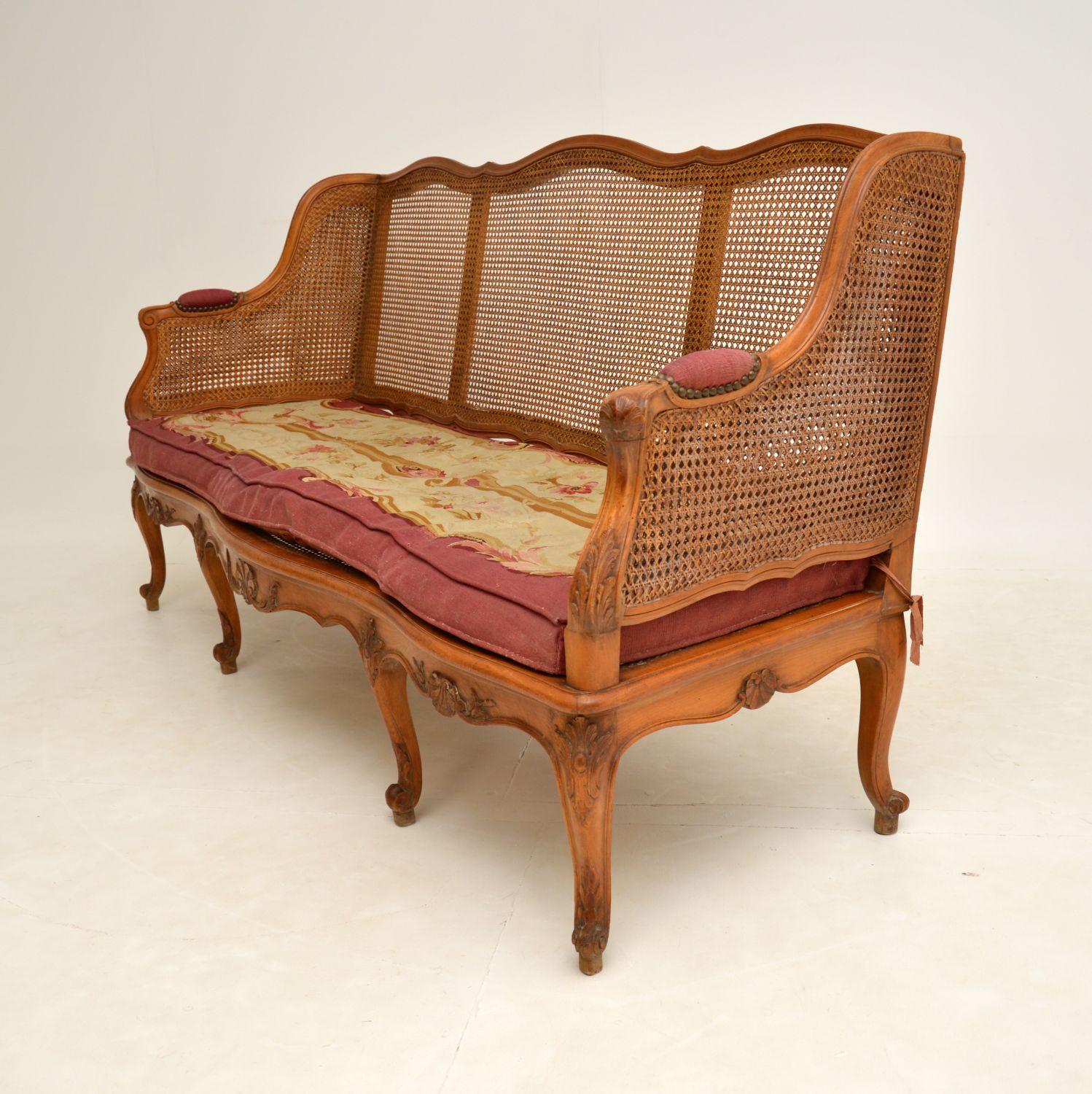 Louis XV Antique French Carved Walnut Bergere Sofa For Sale