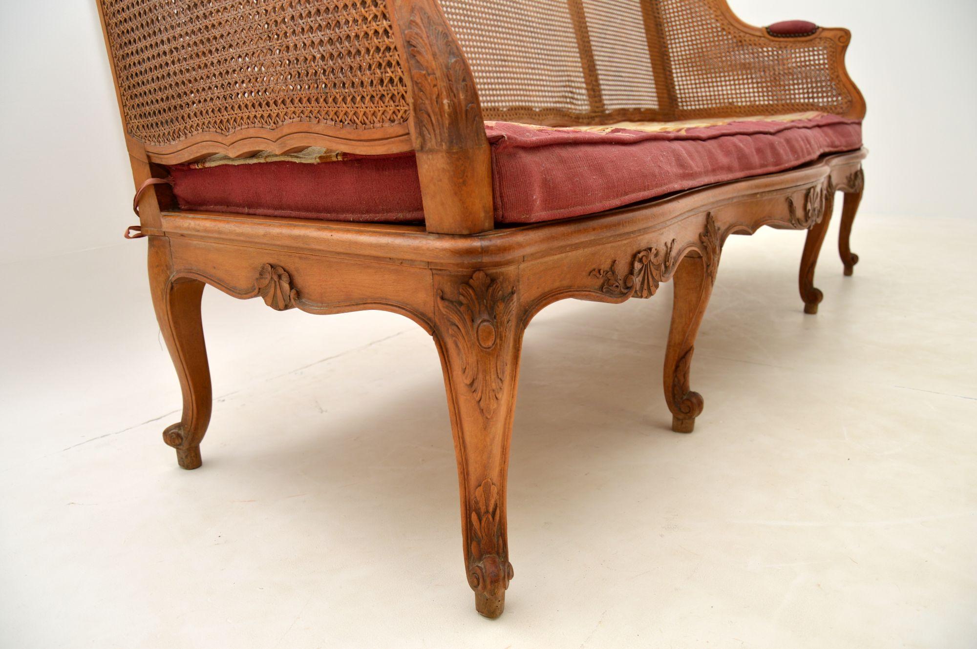 Antique French Carved Walnut Bergere Sofa For Sale 6