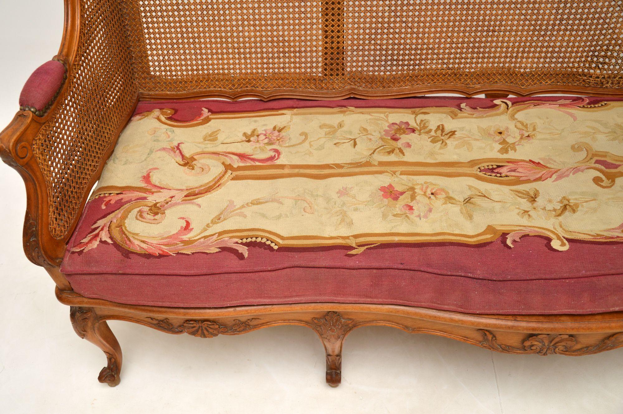 Antique French Carved Walnut Bergere Sofa For Sale 8