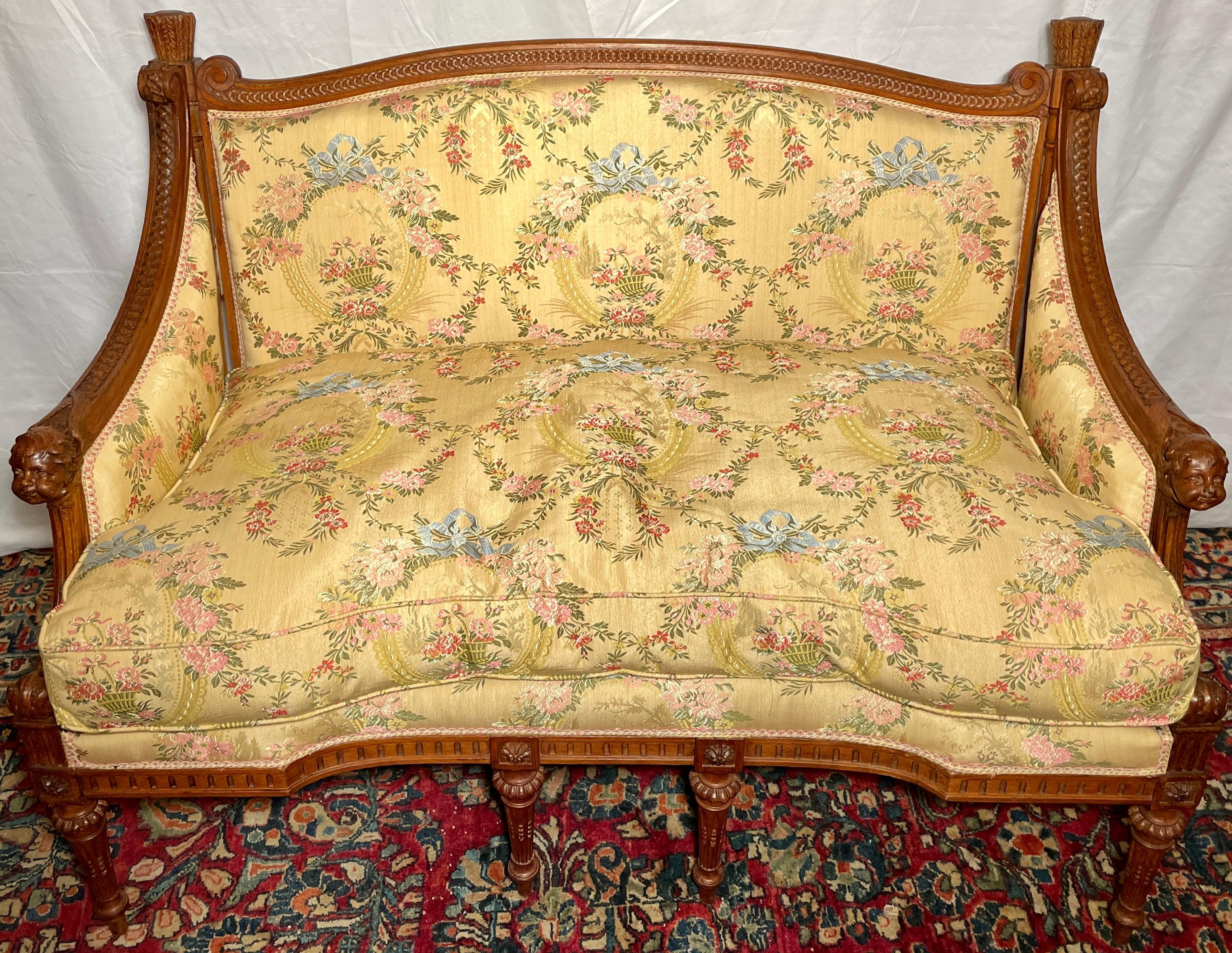 Antique French carved walnut canapé settee, circa 1860. 
Beautiful period-correct yellow silk upholstery. 