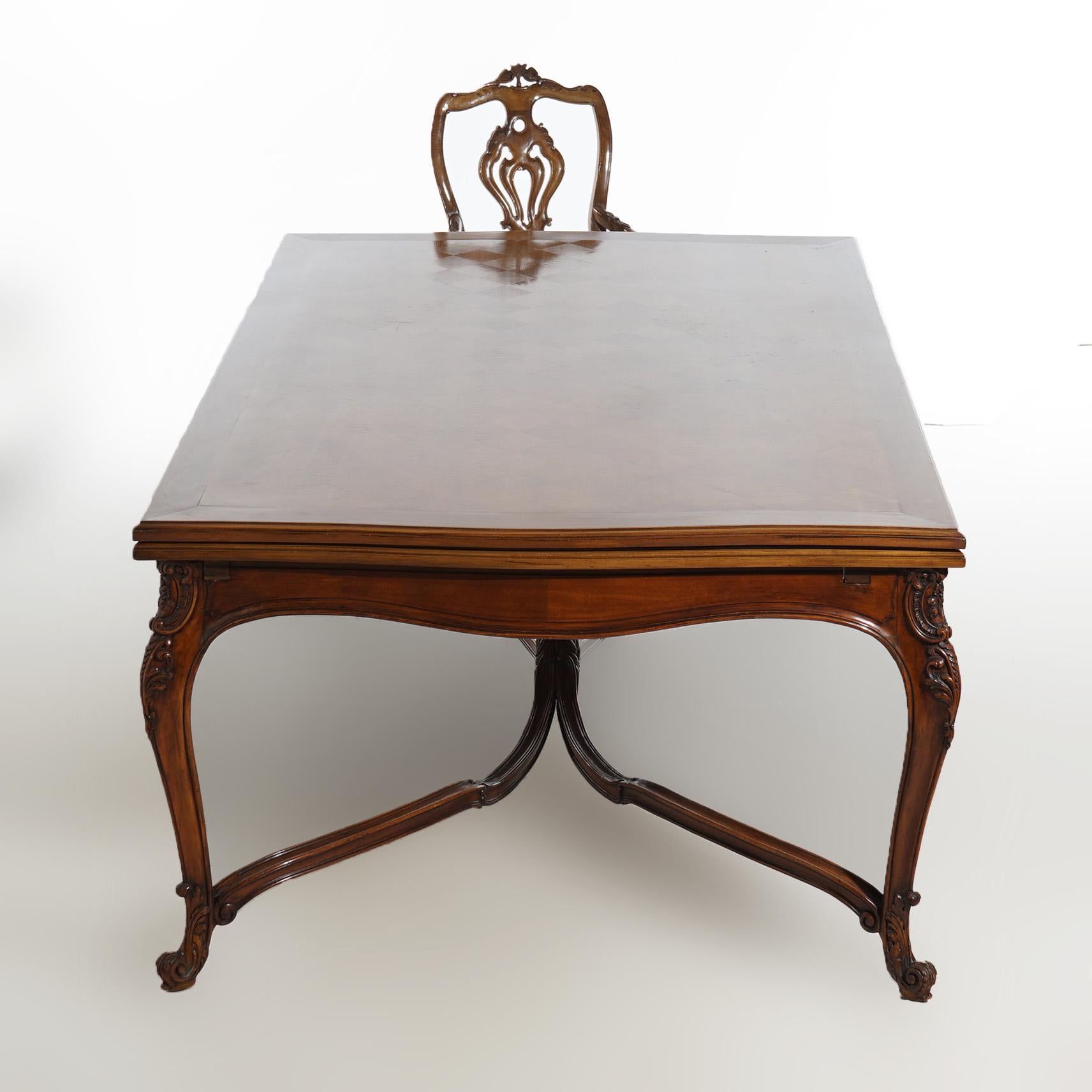 ***Ask About Reduced In-House Shipping Rates - Reliable Service & Fully Insured***

An antique French dining set offers walnut construction with dining table having parquetry and draw top over cabriole legs terminating in scroll from feet; eight