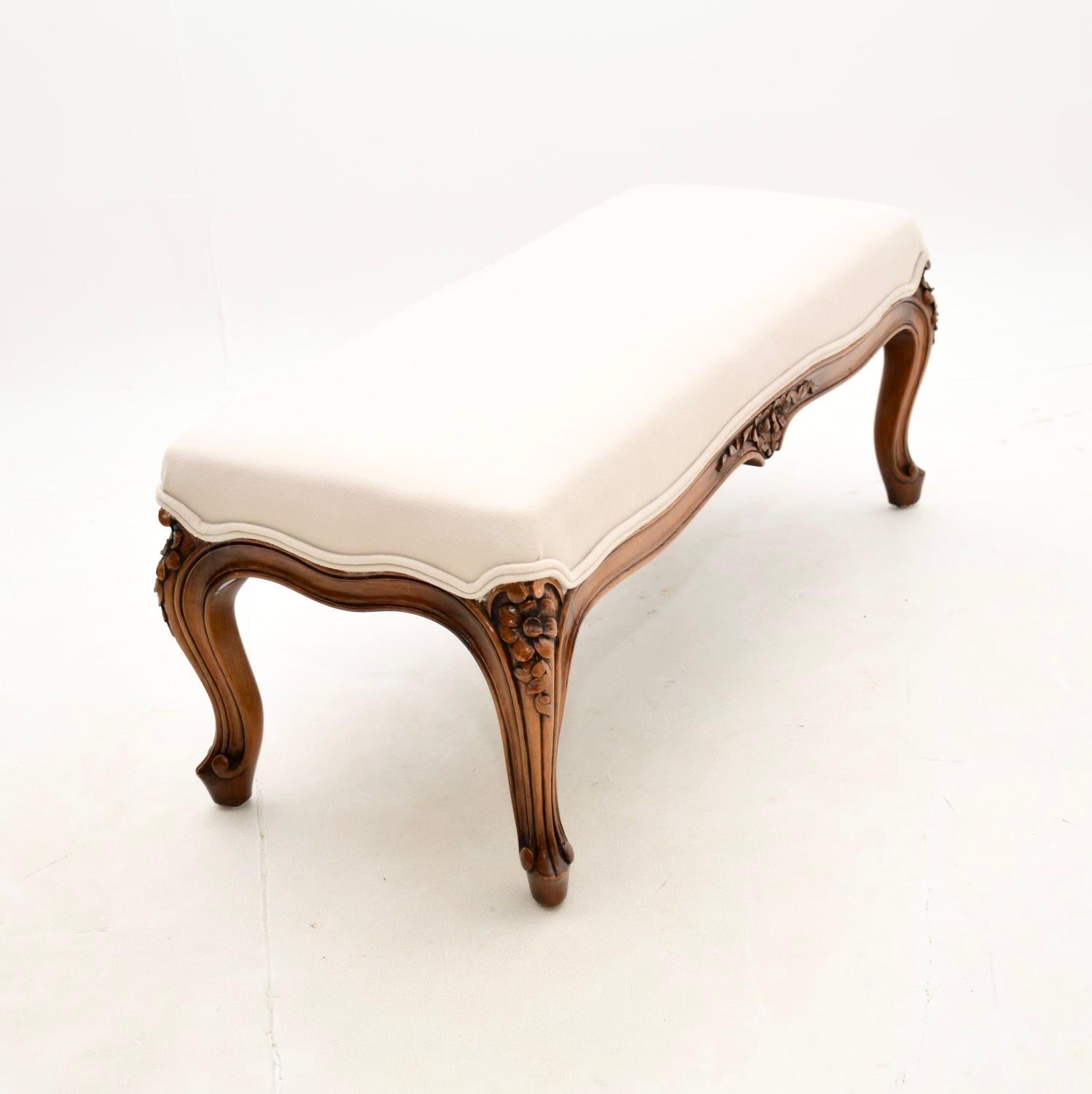 A beautiful antique French carved walnut foot stool. This was made in France, and it dates from around the 1930’s.

The quality is superb, the solid walnut frame has beautiful floral carving, with cabriole shaped legs and serpentine edges.

We have