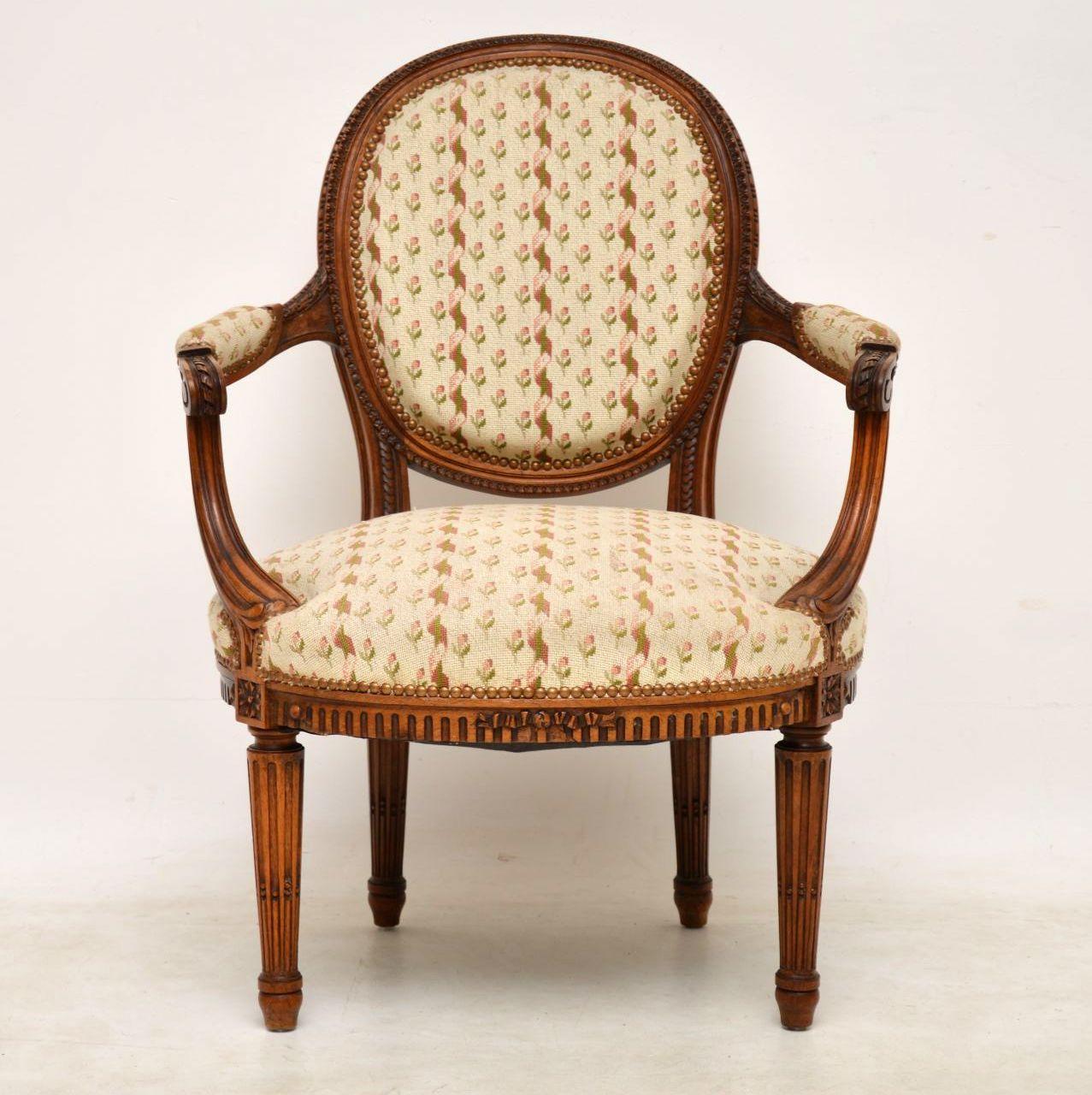 Antique French carved walnut framed salon armchair in good original condition. It’s structurally sound and the upholstery is still okay, although I think the seat springs need a bit of attention. We do normally recover upholstered furniture, but
