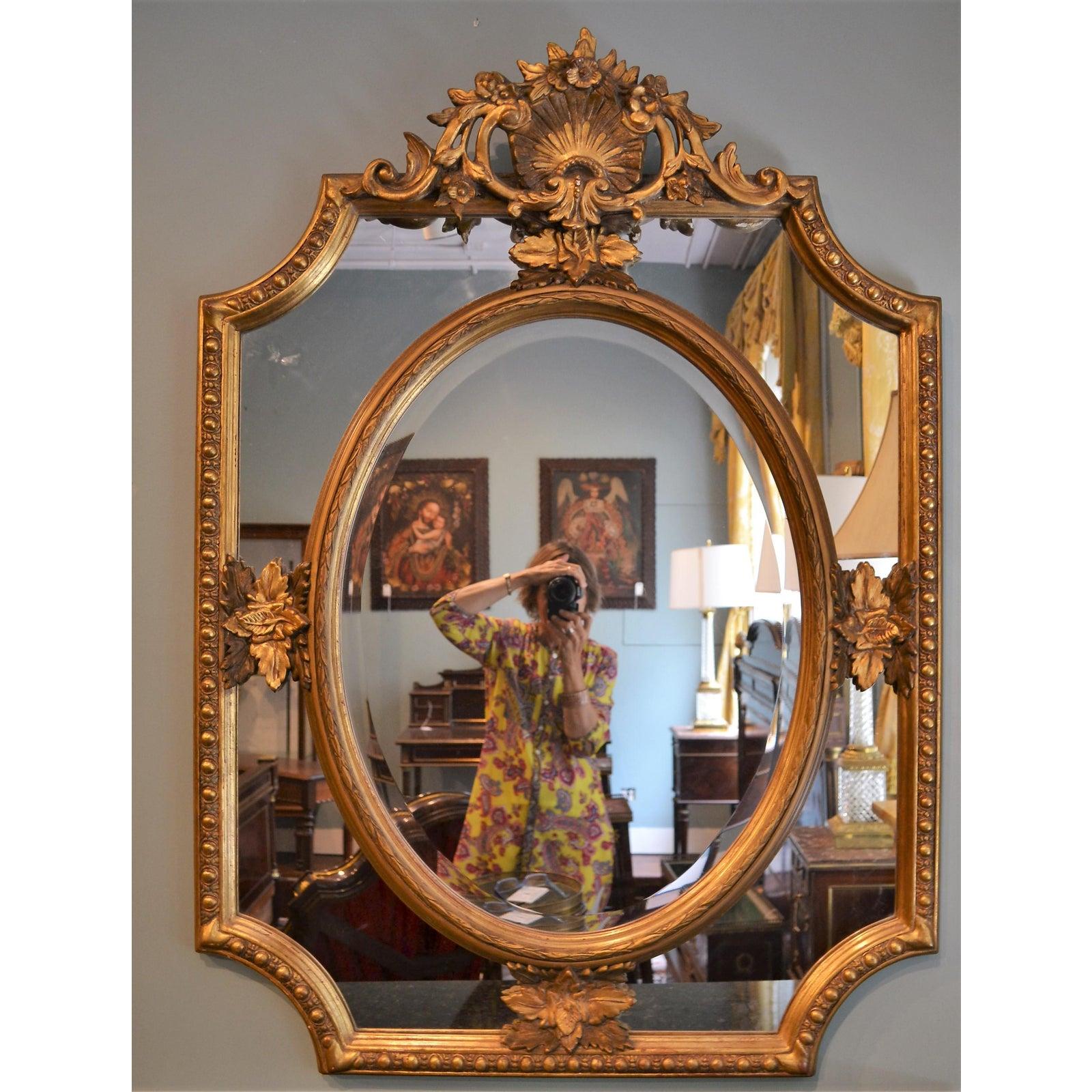 Antique French carved wood and gilt paneled mirror.
 