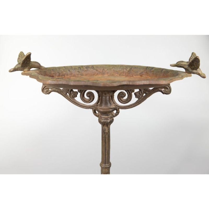 A charming vintage 1940s French cast iron bird bath with beautiful patina. It's the perfect garden ornament for any outdoor setting.

 