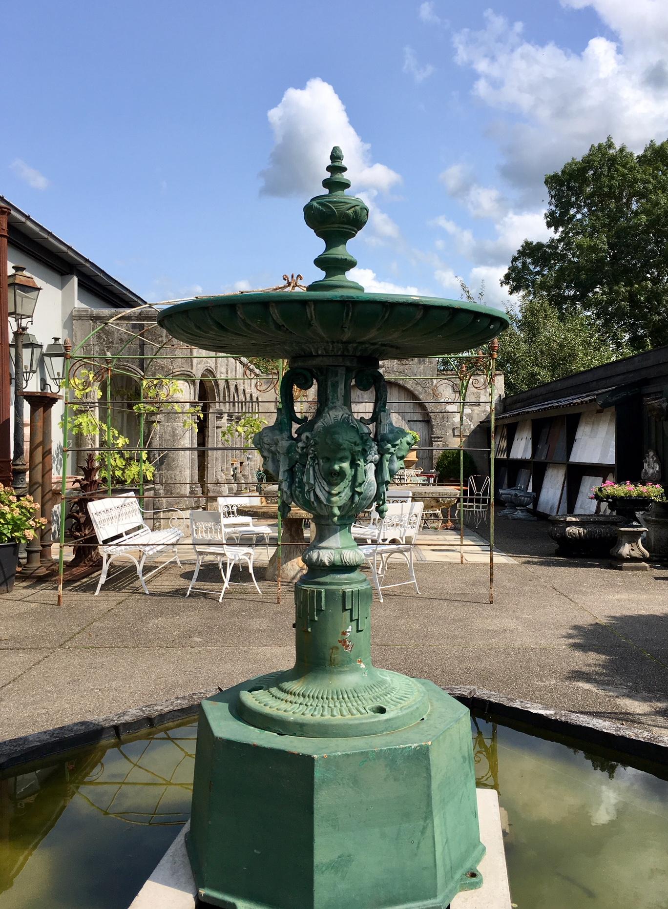 Beautiful antique French cast iron city fountain. Made circa 1900 this fountain decorated a city square. Decorated with Art Deco and Art Nouveau ornaments and women’s heads, from which water sprouts. The fountain is for sale excluding the fountain