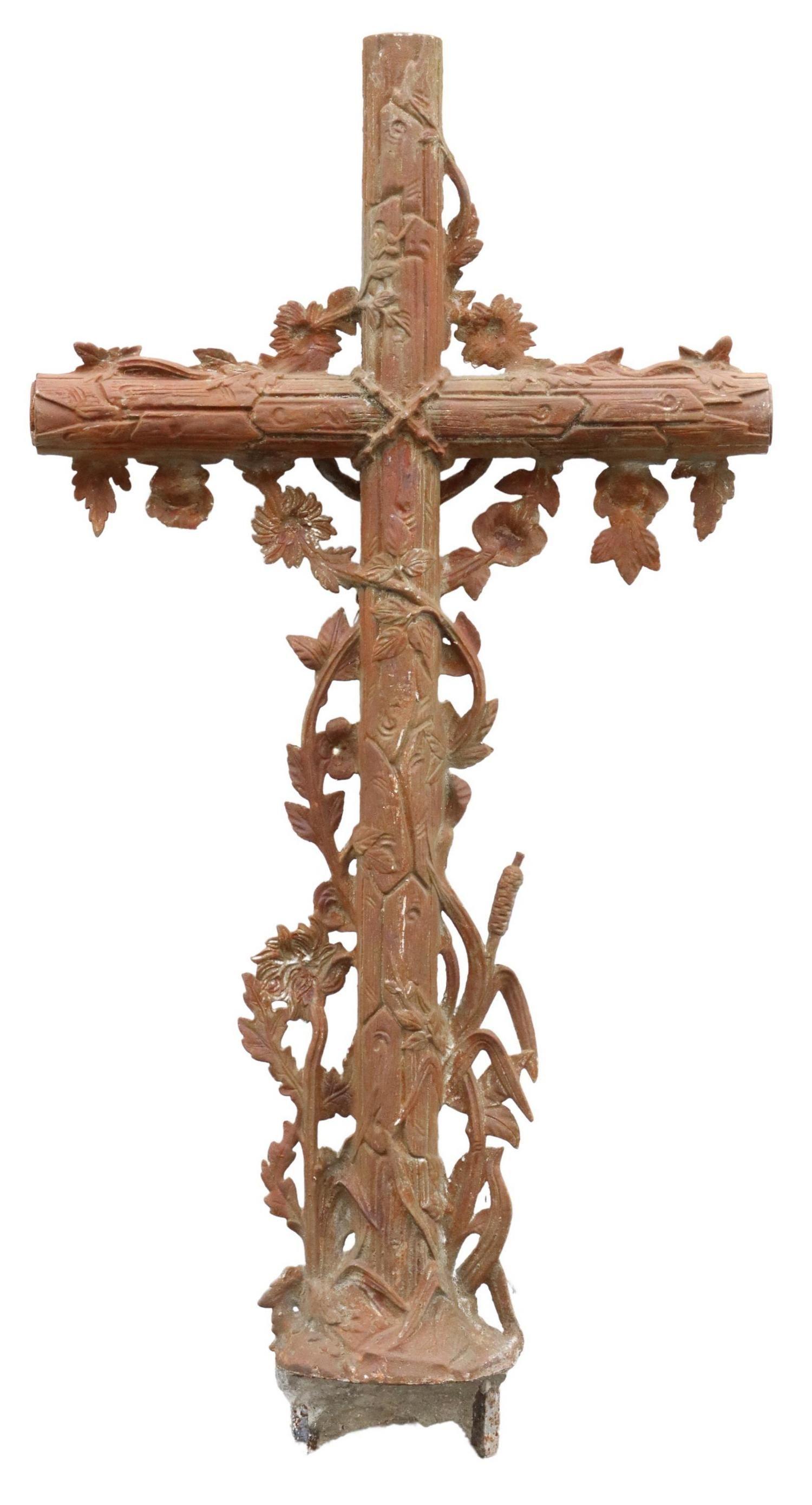 French cast iron cross, 19th century. This faux bois iron cross features trailing foliates, centering Corpus Christi, over reeds.

Dimensions
approx 51
