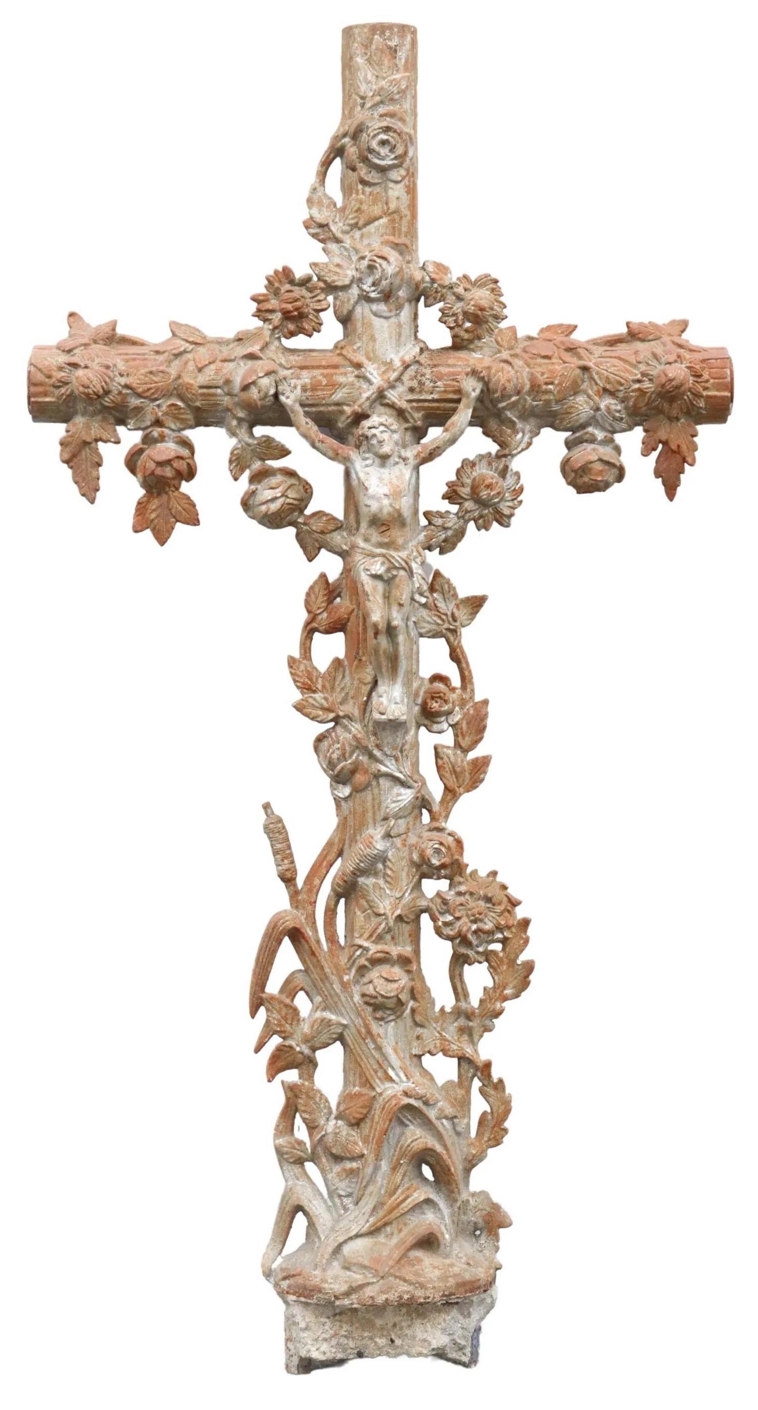 French cast iron cross, 19th c., faux bois cross, surmounted with trailing foliates, centering Corpus Christi, over reeds.

Dimensions: approx 51