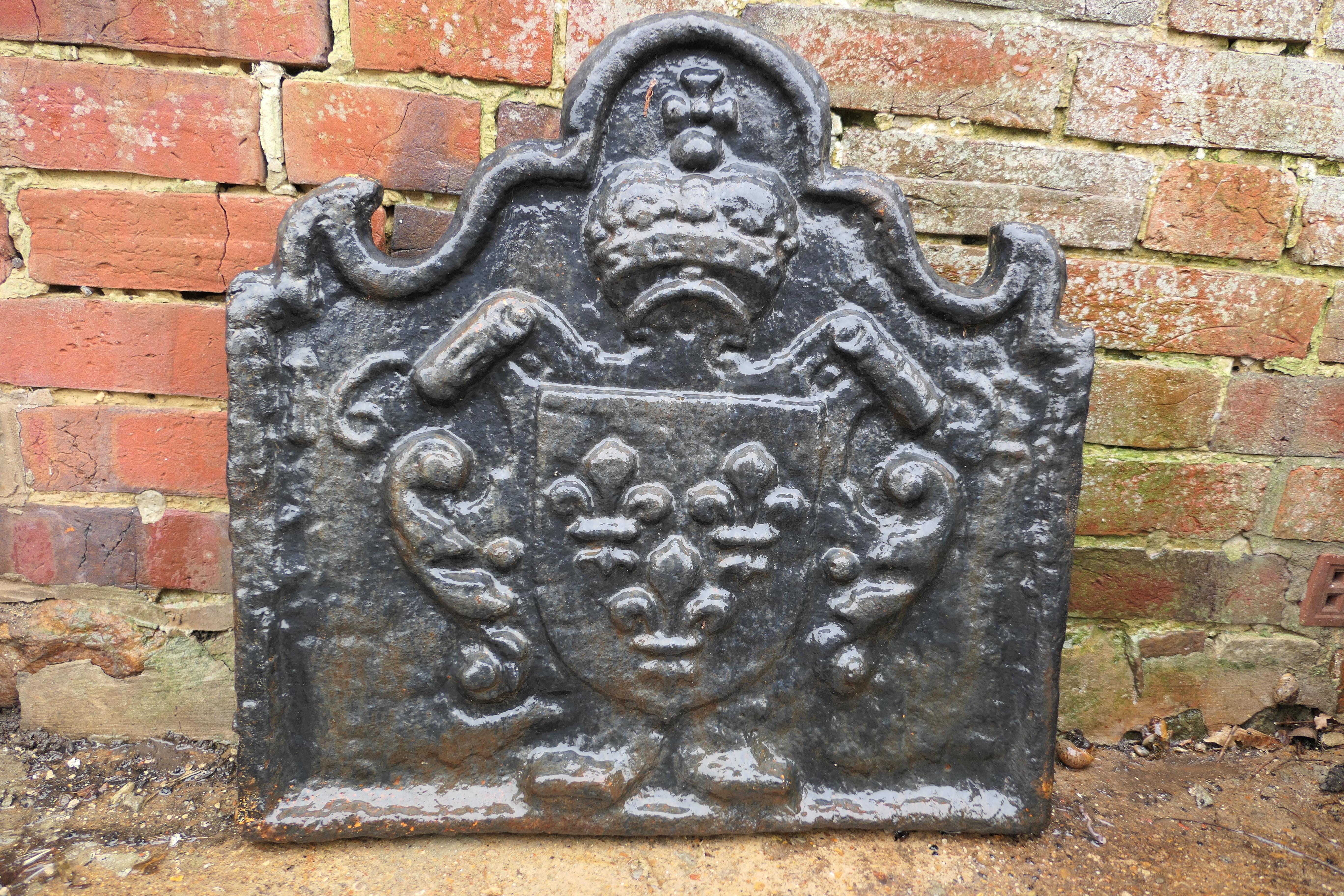 Antique French cast iron fire back

The Fire back is extremely heavy, it is decorated with the “Armes de France” with the Crest of the House of Bourbon 

The crest consists of a crown with 3 fleurs de lys and the date 1622 is clearly seen
Size