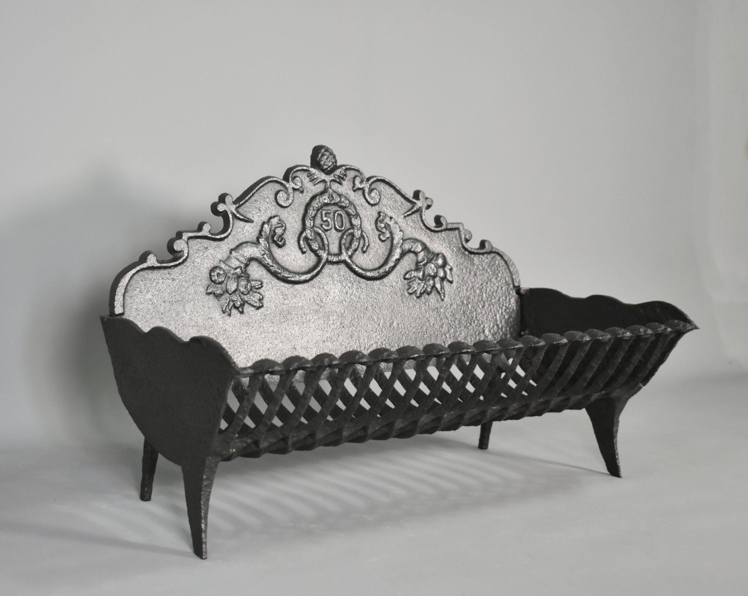 Antique French Cast Iron Fire Grate Napoleon III Style
 
This pretty cast iron fire grate has a raised backplate with the number 50 embossed in the centre.
 
It features delicately woven fretwork within the basket and stands on finely cast