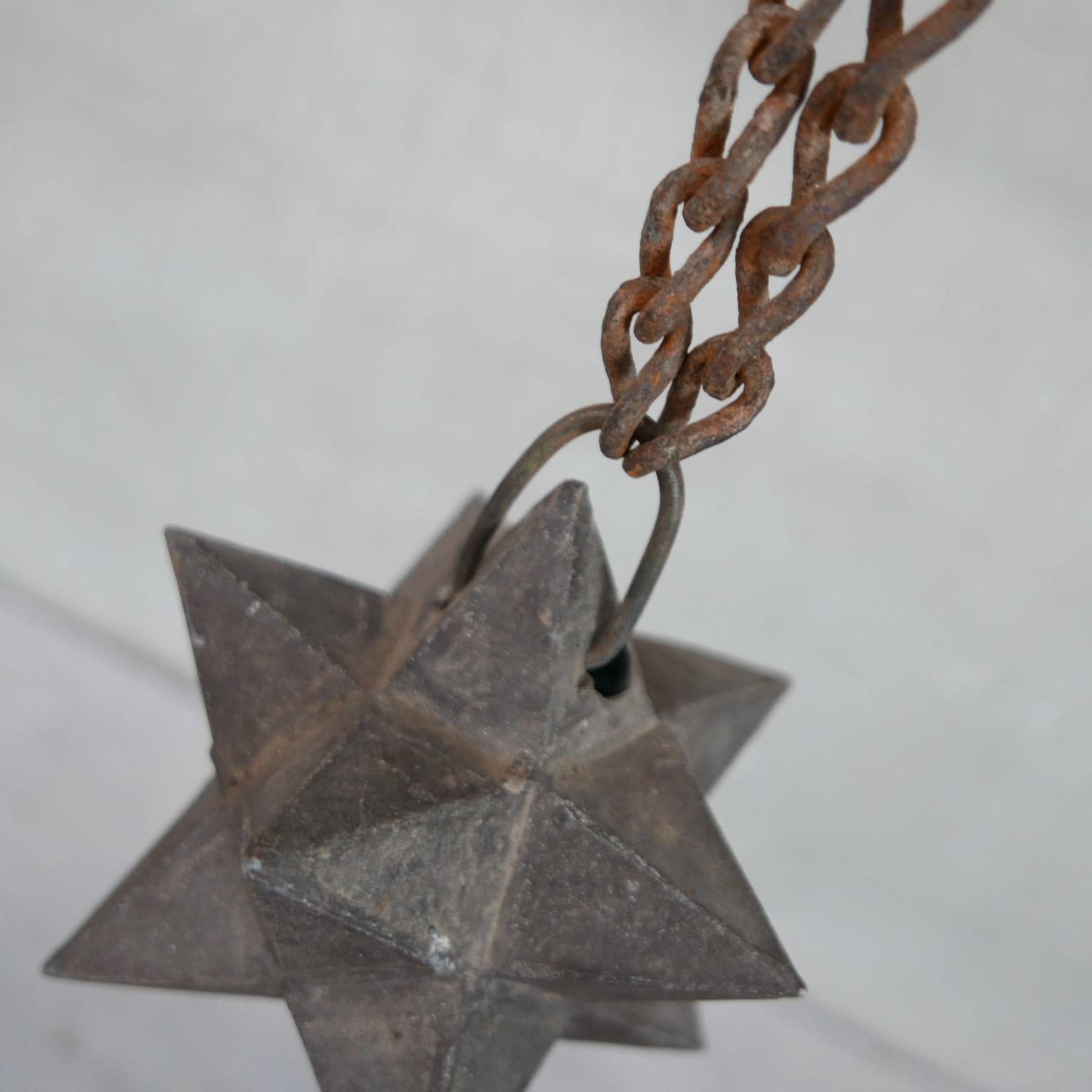 A rare pair of unusual star curios. 

Geometric forms hoisted on a chain. 

France, 19th century. 

Iron, naturally patinated. 

One has damage, priced accordingly. 

Can be used hanging or as a desk or shelf curio. 

Location: Belgium