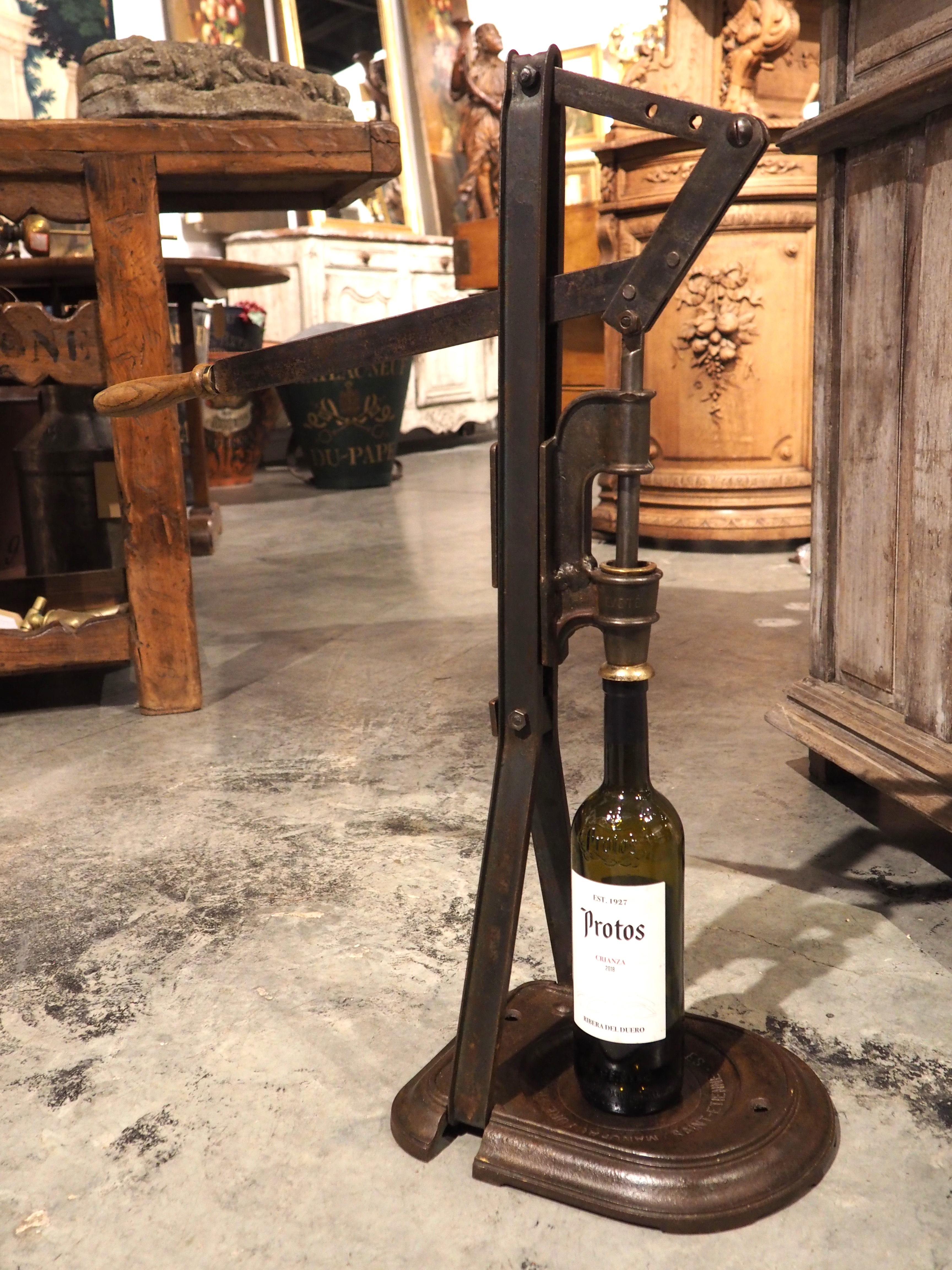 Known in France as a bouchonneuse, this cast iron wine bottle corker would have been used at a French vineyard in the early 1900s. Before the advent of mass production methods, a bouchonneuse such as this would have been bolted to the floor (as