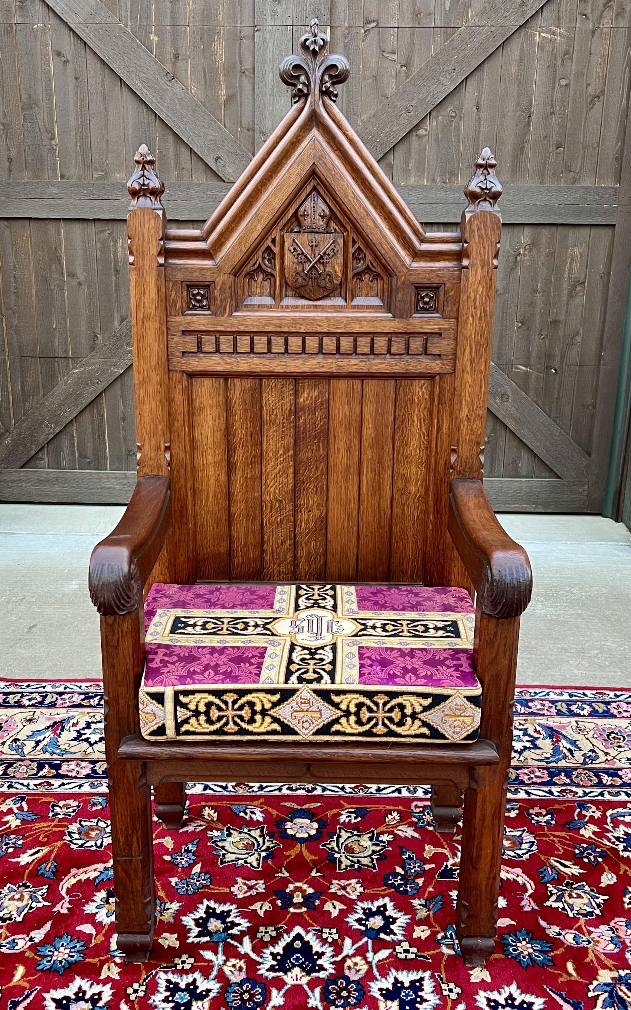 OUTSTANDING Antique French Oak GOTHIC REVIVAL Bishops Throne Altar Chair with Reversible Liturgical Cushion~~HIGHLY CARVED ~~c. 
1880s


        Highly detailed Gothic accents~~the mitre on the crown represents the bishops' headgear and the crossed