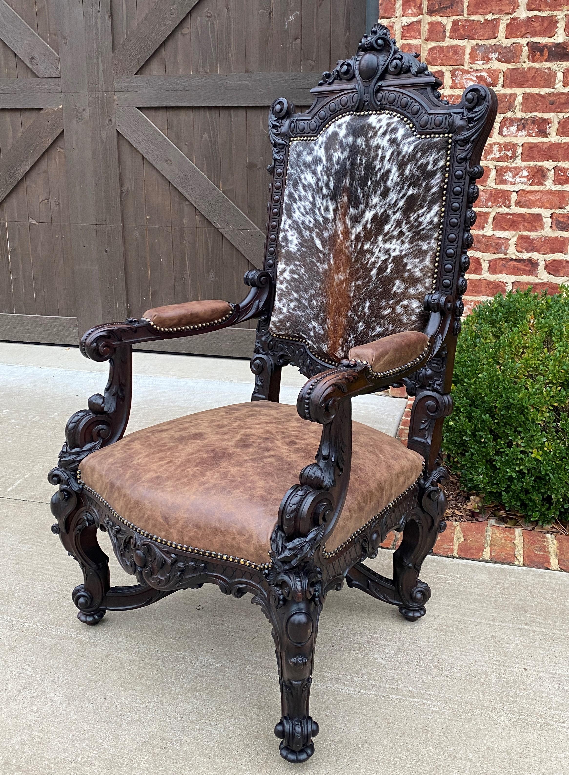 Antique French Chair Leather Cowhide Baroque Carved Oak Fireside Throne c. 1900 In Good Condition In Tyler, TX