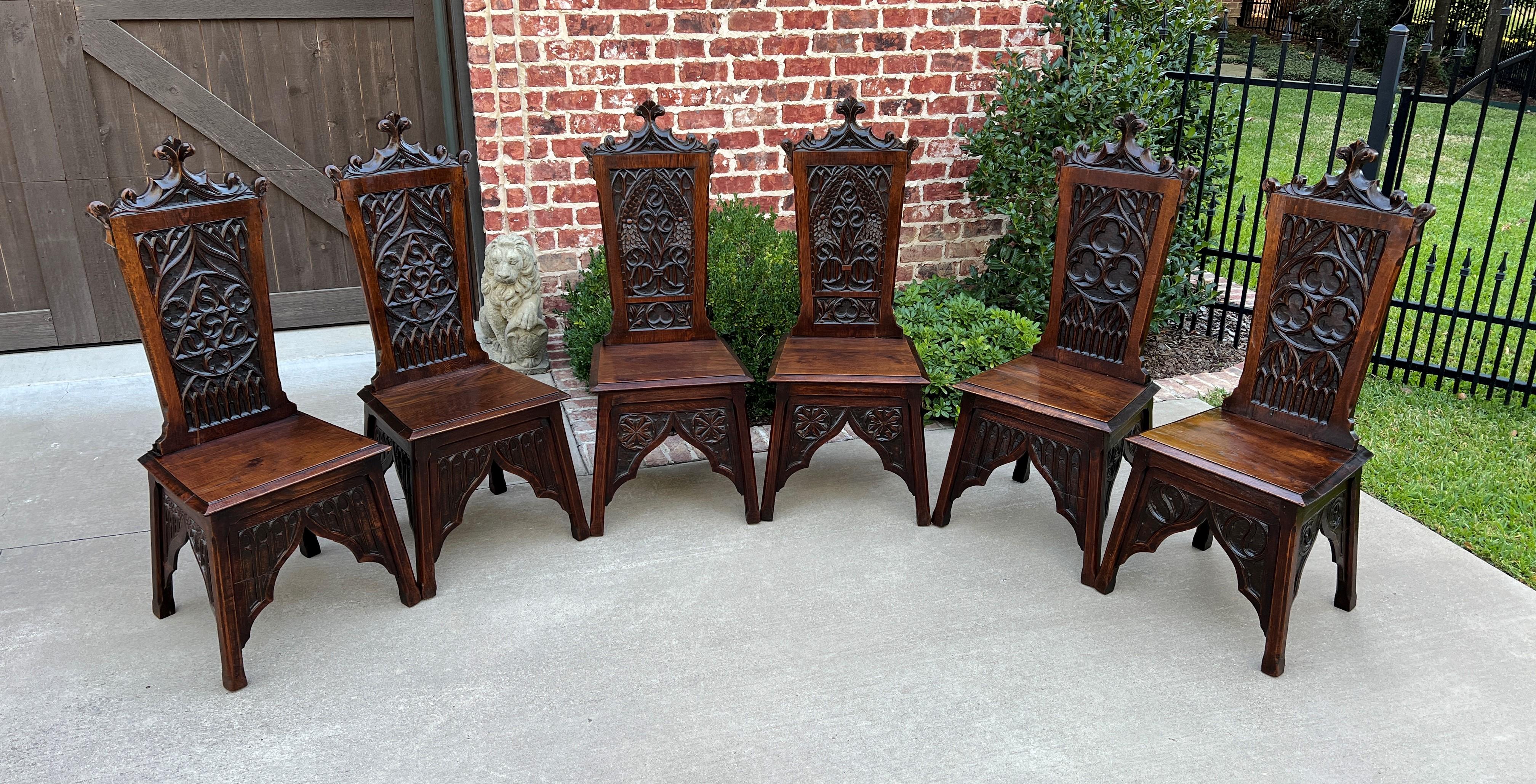 Gorgeous antique French oak gothic revival set of 6 dining or side chairs~~c. 1880s-1890s 

HARD-TO-FIND SET OF 6 highly carved oak chairs~~crown finials, linen fold and trefoil accents with Gothic arches and hand carved spandrels~~a fine example