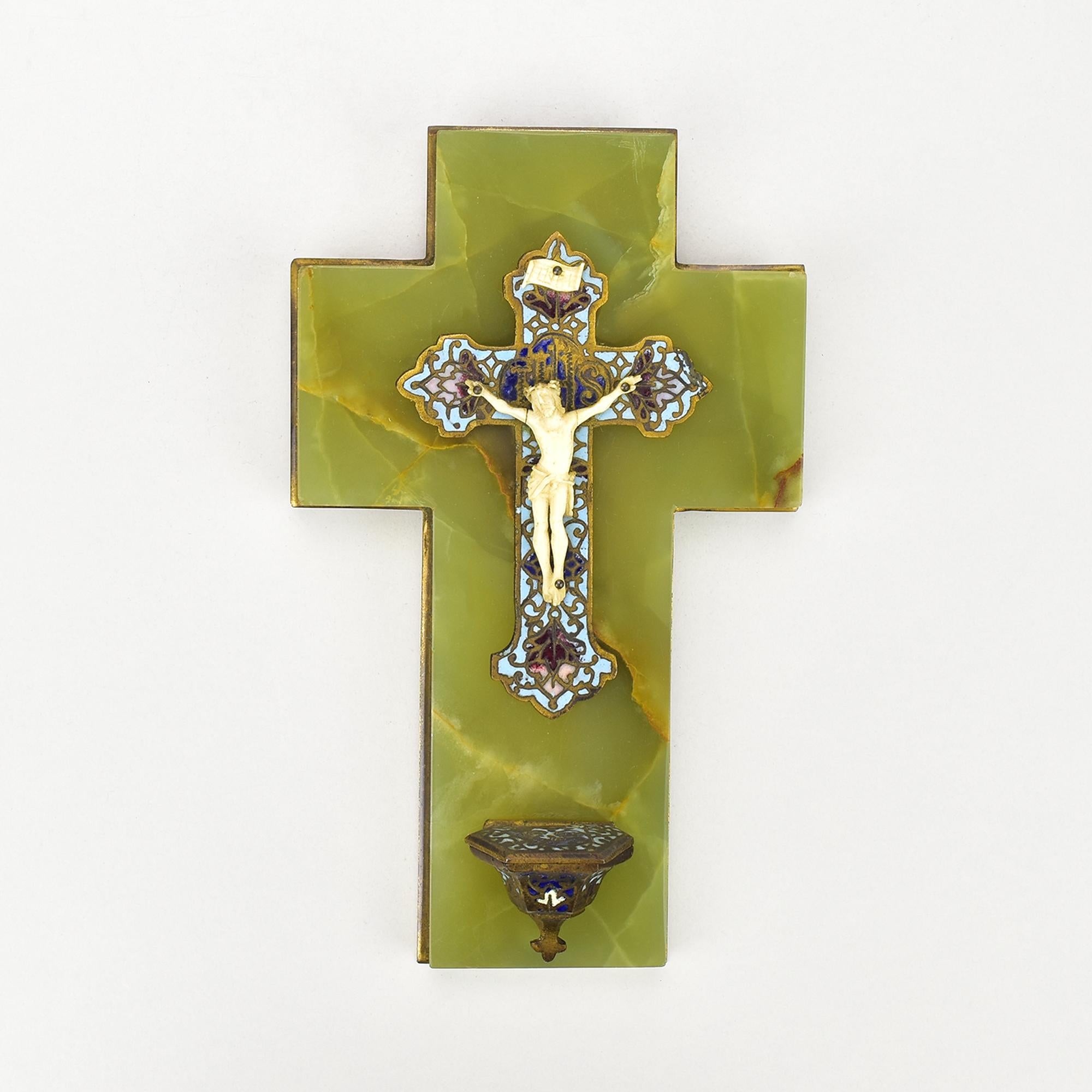This antique French Victorian gilt champlevé cloisonné crucifix is a magnificent and rare religious artifact that exemplifies the artistry and craftsmanship of the Victorian era. The crucifix is made from gilt metal, a process where a thin layer of