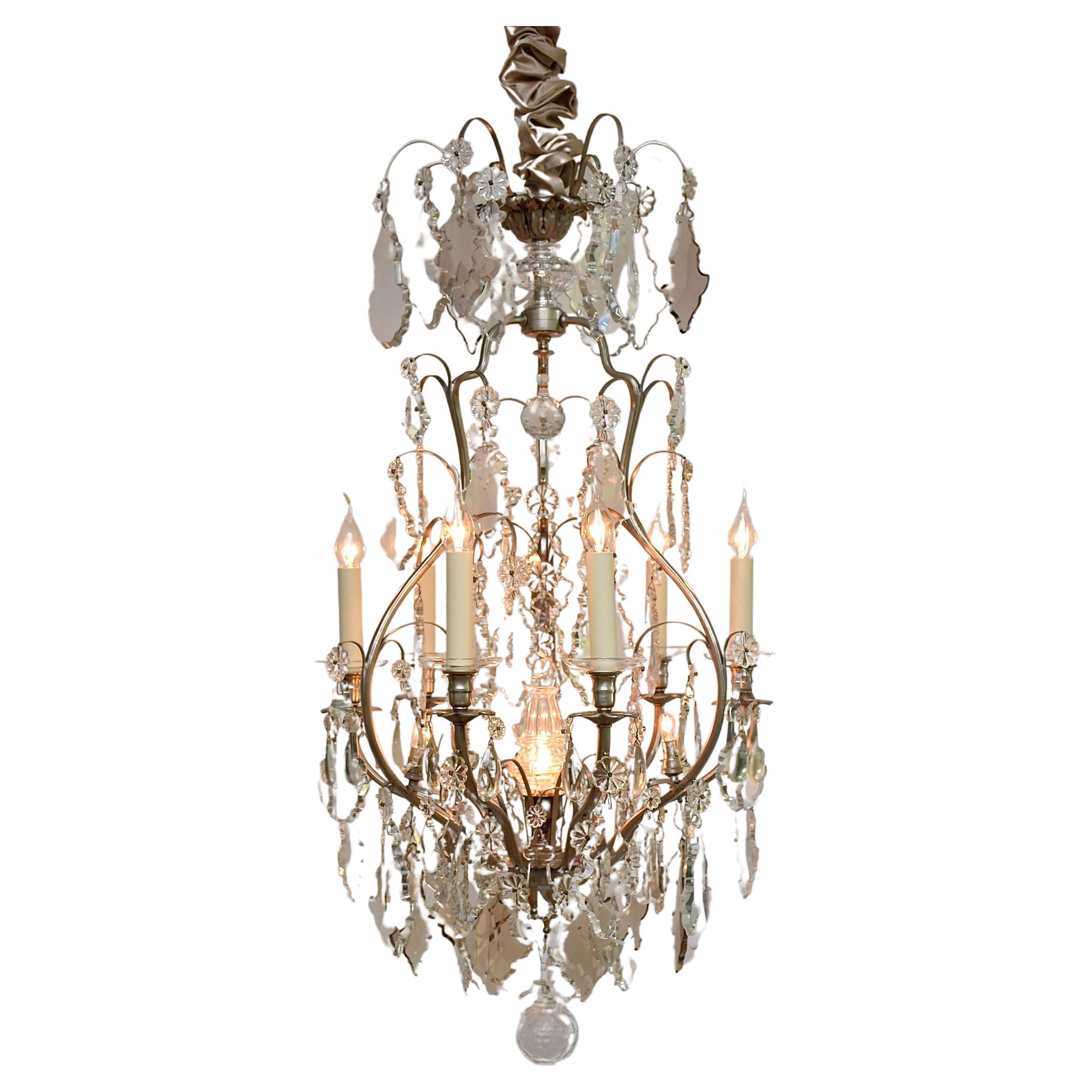 Antique French chandelier with clear and soft coloured crystals