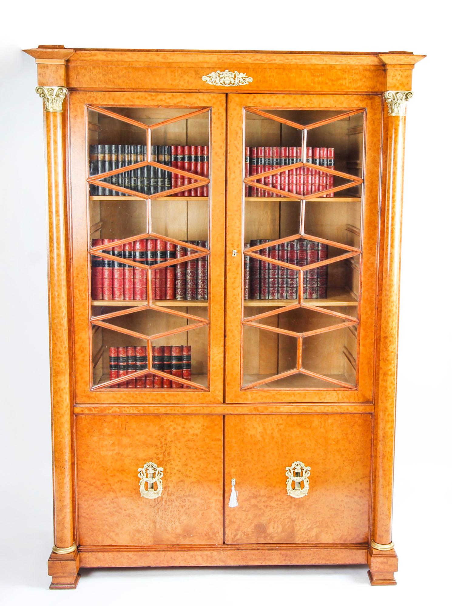 This is a beautiful antique French Charles X burr maple bookcase with fabulous ormolu mounts, circa 1820 in date.
 
It has been crafted from the finest burr maple and is decorated with finely cast ormolu mounts typical of the Empire style.

It