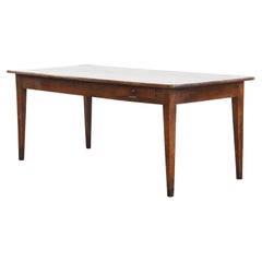 Antique French cherry wood dining table with a large extendable top