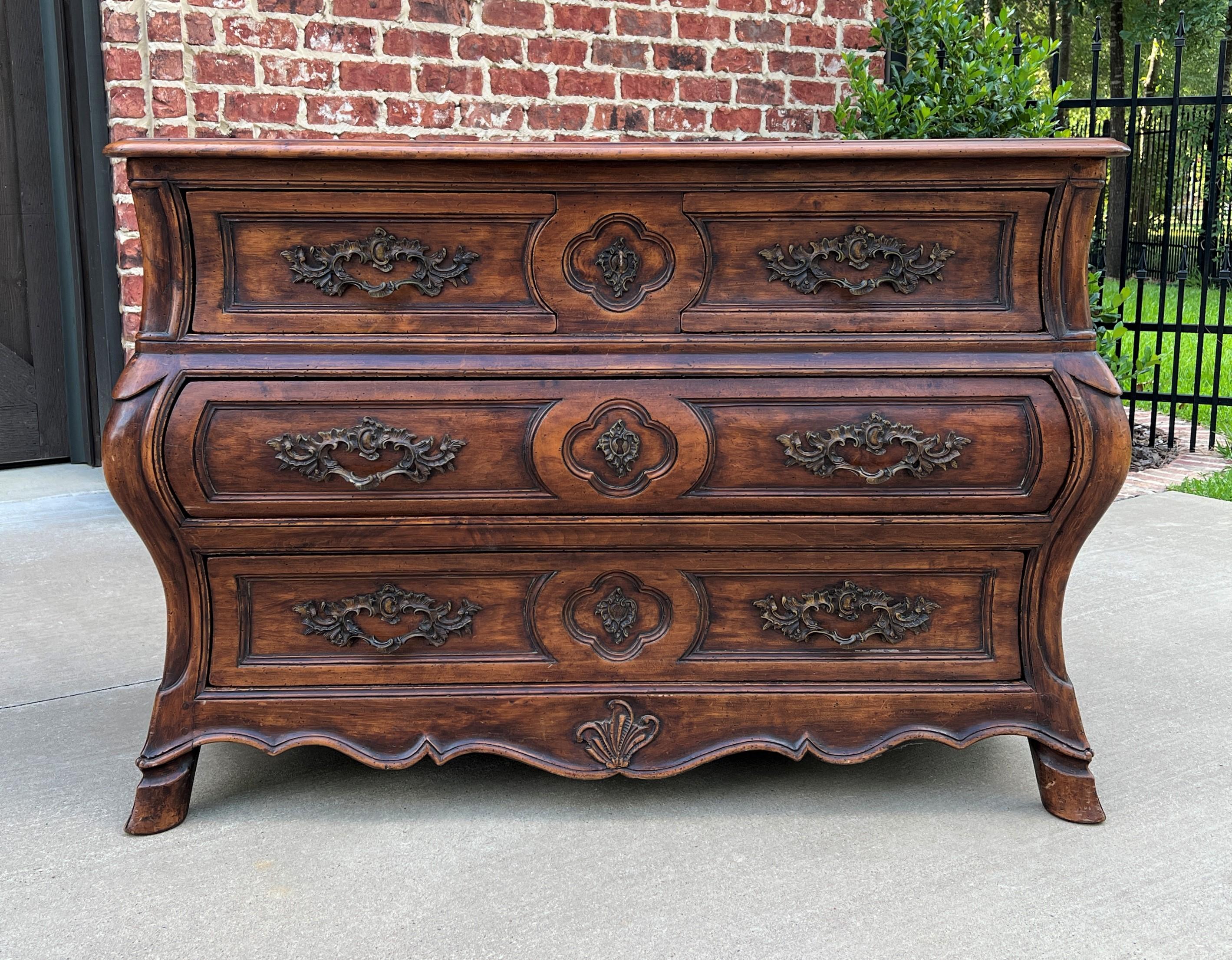 Exquisite Antique French Walnut Louis XV Style Bombe chest of drawers or Commode~~Early/Mid 19th Century

This is a SUPERB example of an antique French walnut bombe style chest of drawers or commode with hoof feet~~highly carved with serpentine