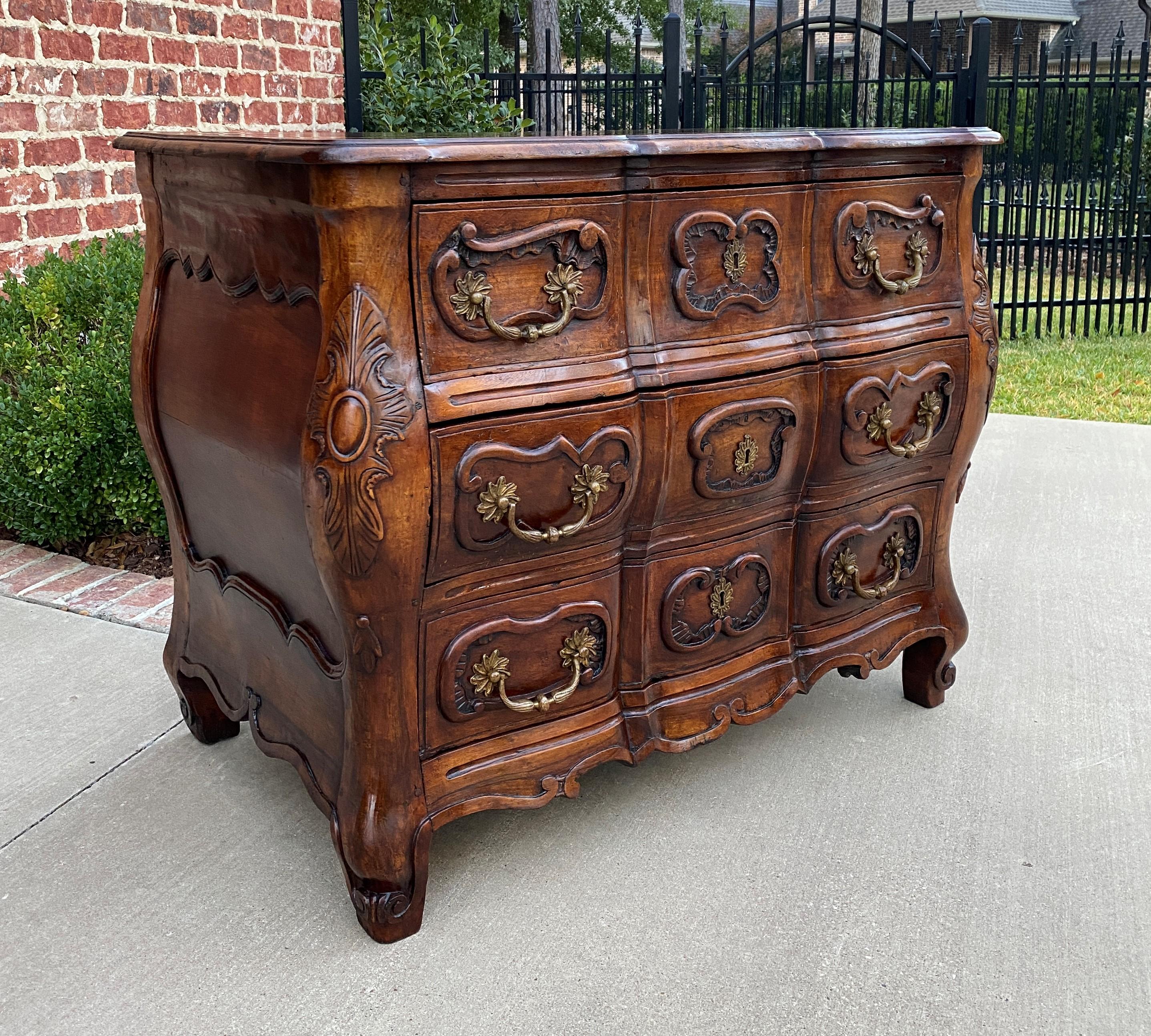 Exquisite antique French walnut 18th century Louis XV style bombe chest of drawers or commode

 This is a gorgeous example of an antique French walnut bombe style chest of drawers or commode with cabriole legs~~highly carved with serpentine shaped
