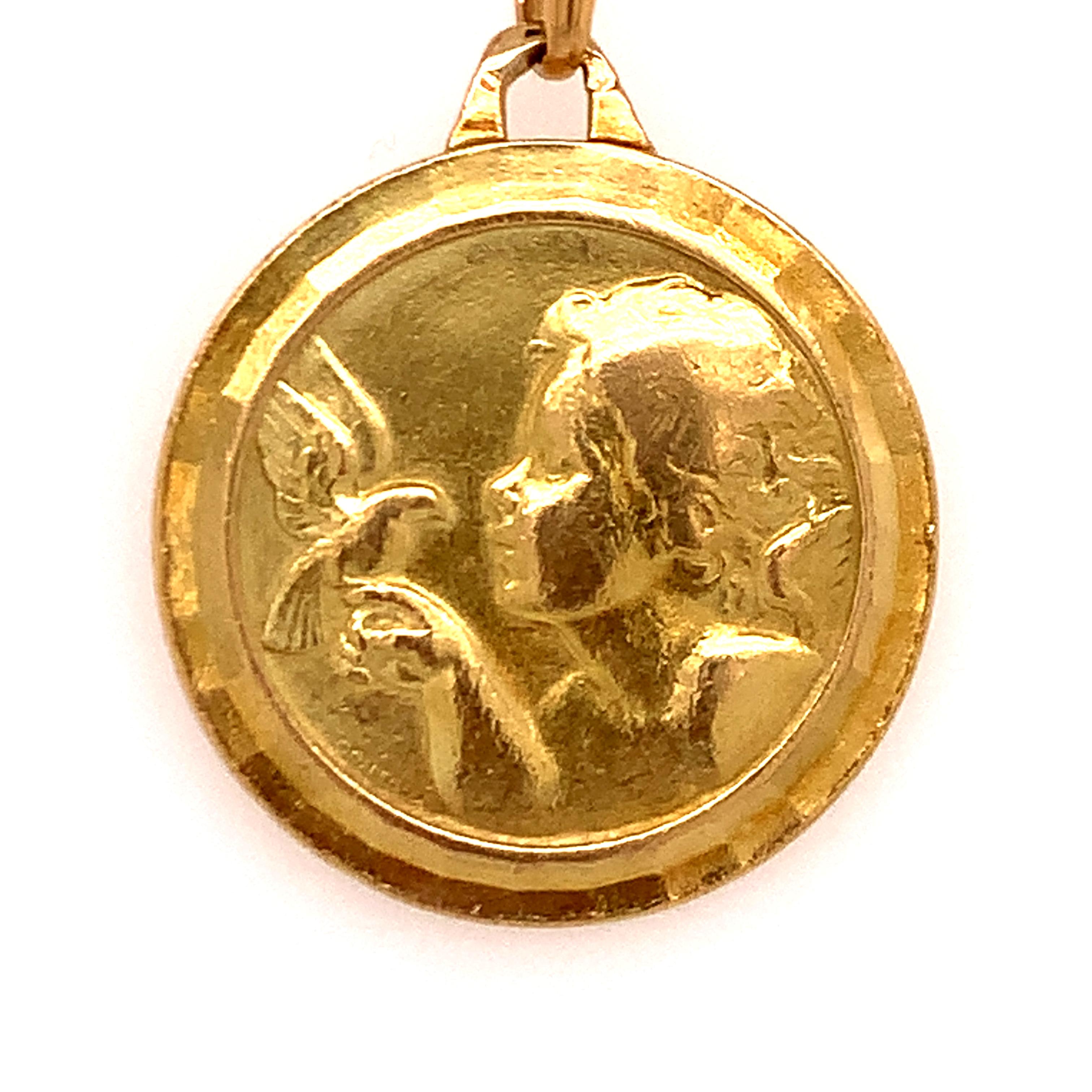 Most charming pendant/charm:  a bust of a  young girl, holding a dove on her outstretched finger.  18K yellow gold.  3/4
